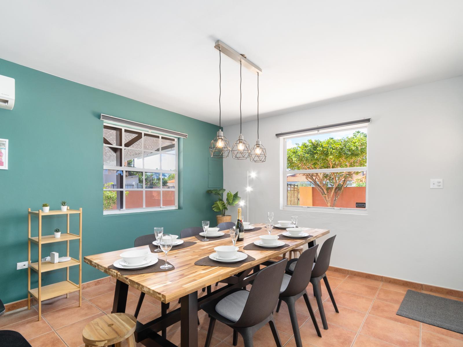 Well-Designed Dining Area of the 3BR House in Noord Aruba - Open floorplan dining - Well-chosen lighting fixtures adding both functionality and charm - 8 Persons Dining - Chic dining area featuring a stylish table and contemporary seating