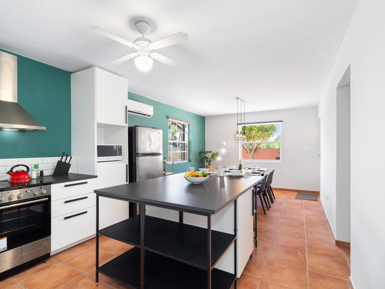 Polished Kitchen of the 3BR House in Noord Aruba - Fully Equipped - Stainless Steel Appliances and clutter-free counters - Smart use of space with versatile storage solutions - Thoughtful placement of kitchen essentials for easy access