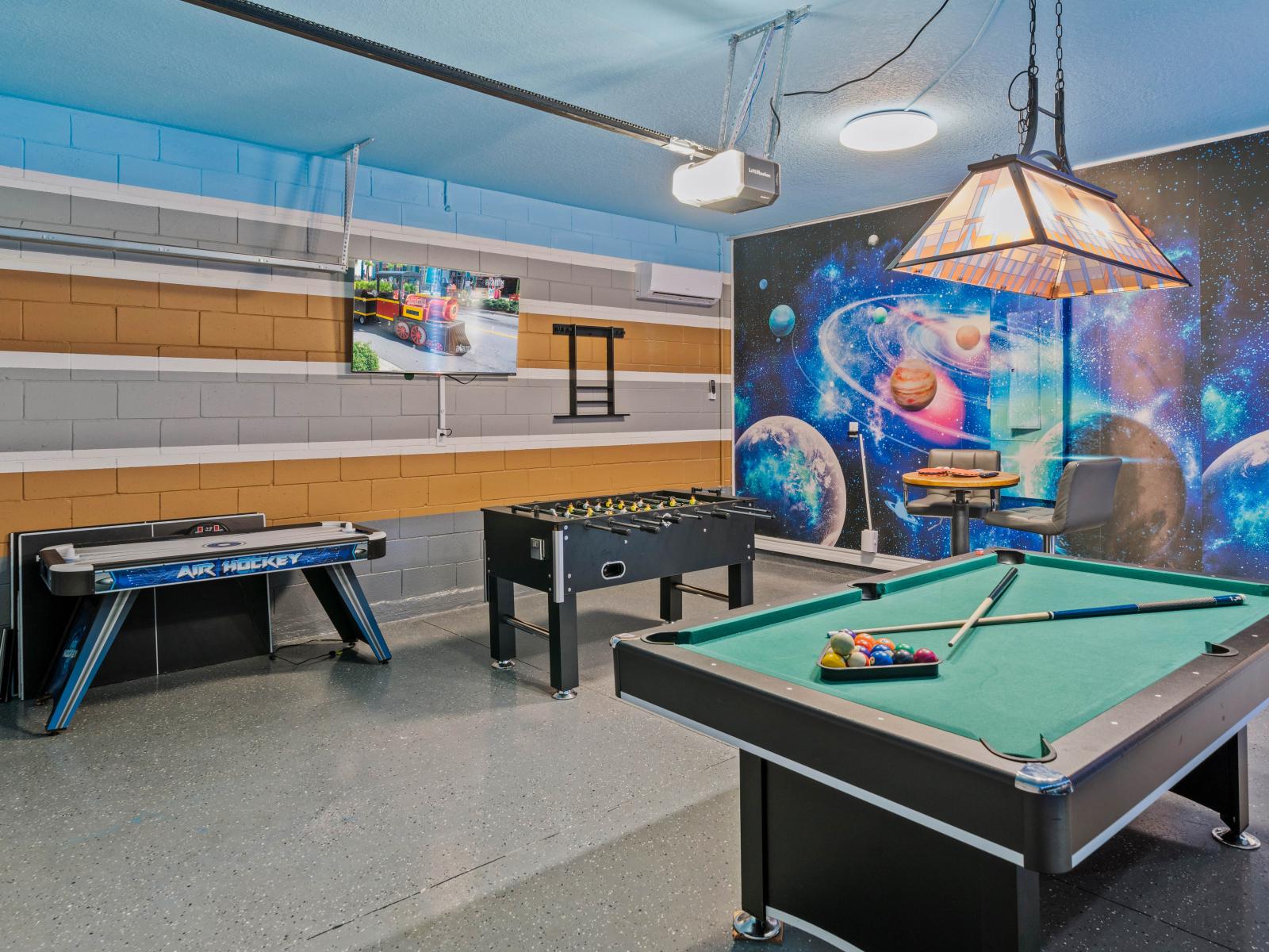 Step into our game room oasis, complete with a pool table and foosball table—a perfect retreat for family and friends to enjoy.