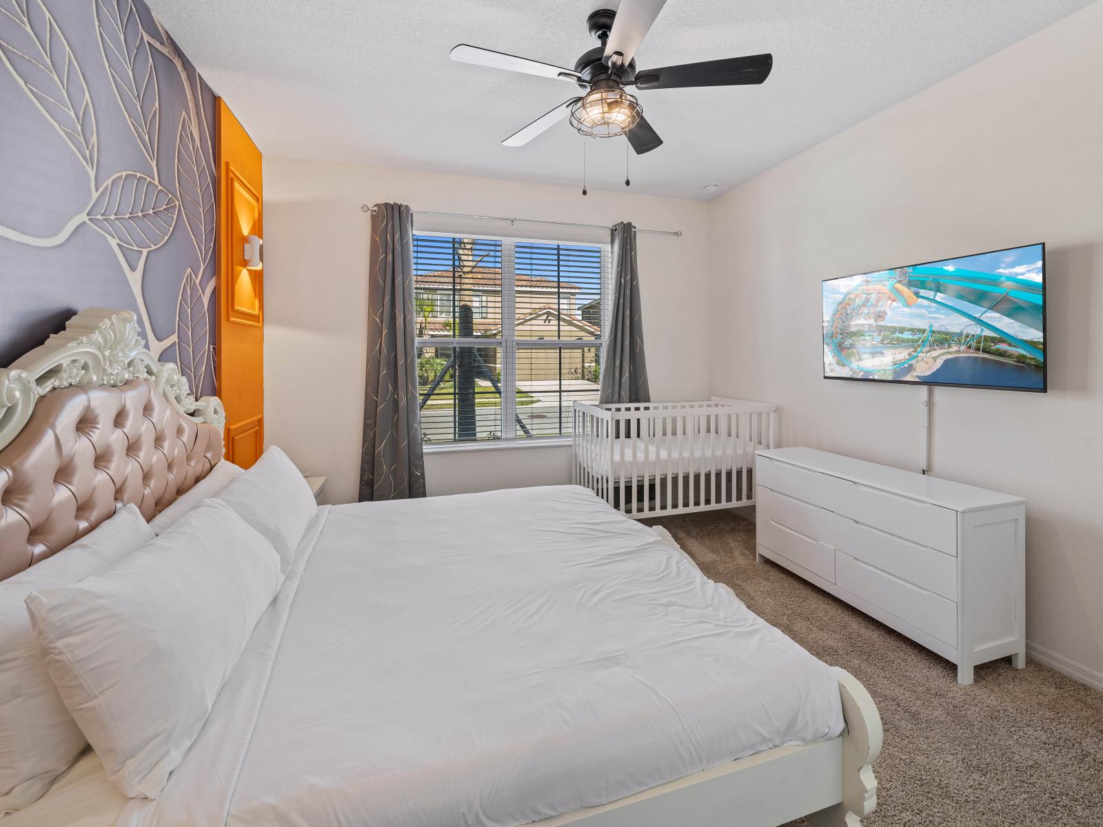 Indulge in Bedroom 1's spacious setting, complete with a king-size bed and private bathroom, ideal for relaxation.