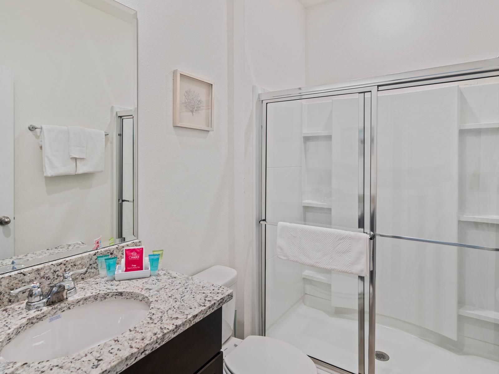 Refresh in style with the sleek walk-in shower of Bathroom 1.