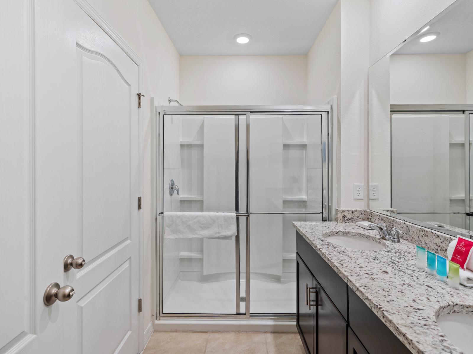 Indulge in relaxation with the contemporary walk-in shower of Bathroom 4