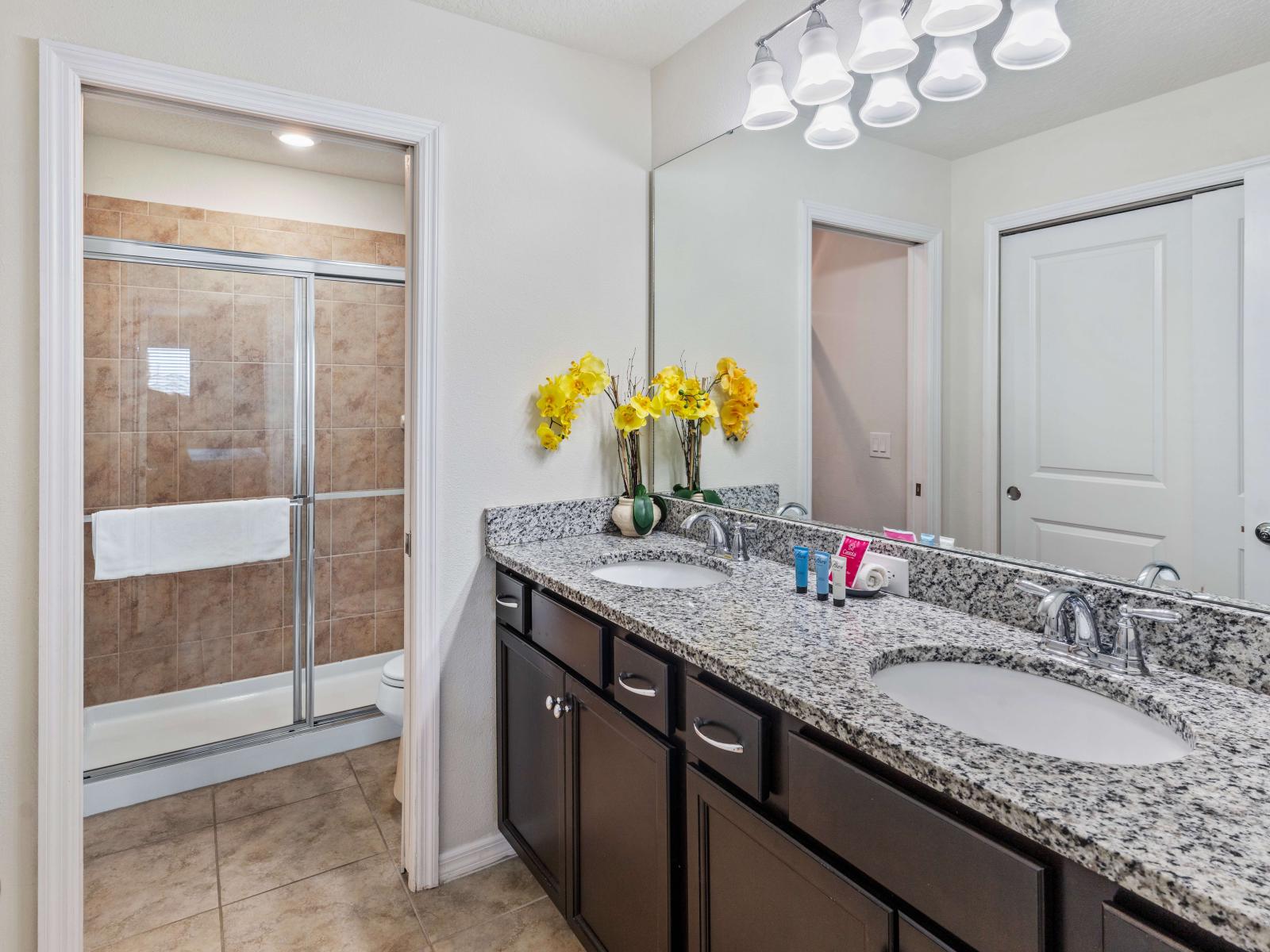 Discover Bathroom 4's stylish amenities, including a spacious walk-in shower perfect for unwinding after a long day.