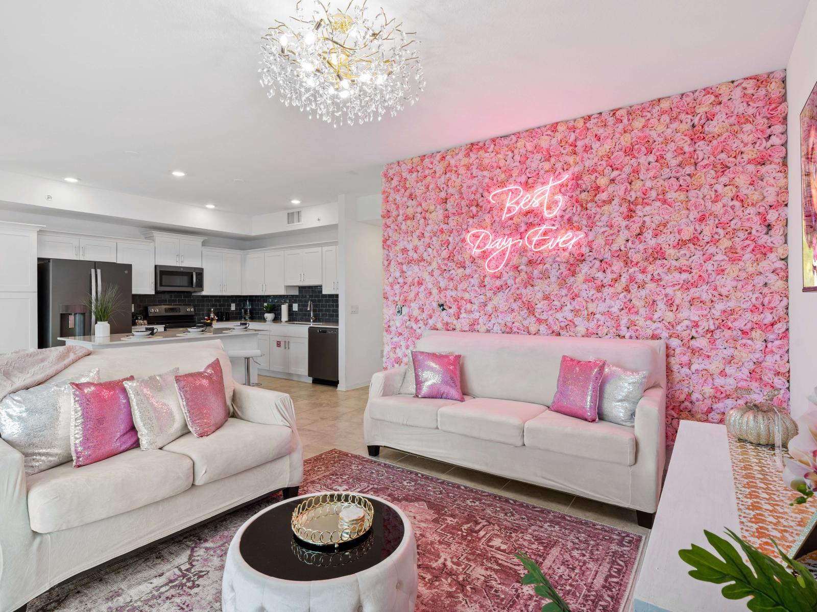 A studio like design of the living area with a floral background wallpaper fronting the private balcony