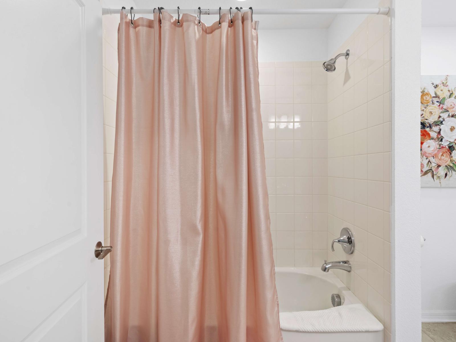 Bathroom 2 with a bathtub and shower combo