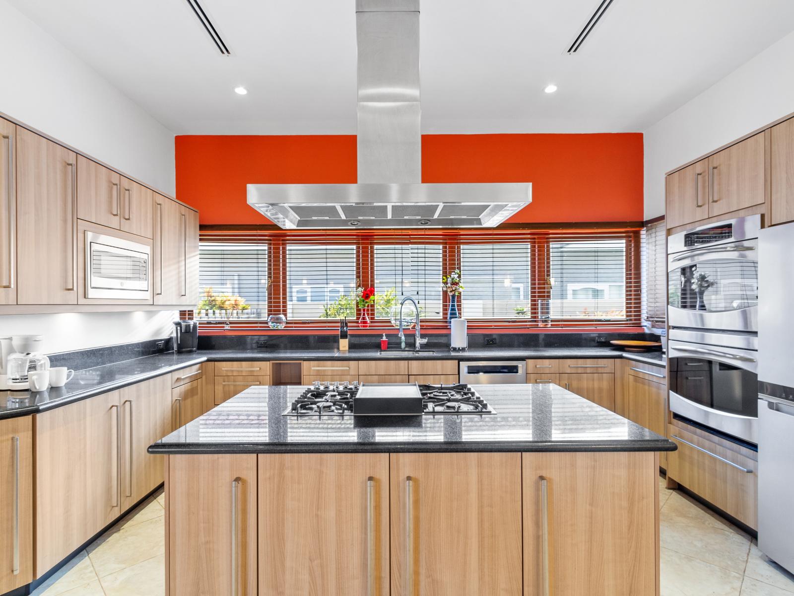 Kitchen features granite countertops, stainless steel appliances, and pristine white cabinetry