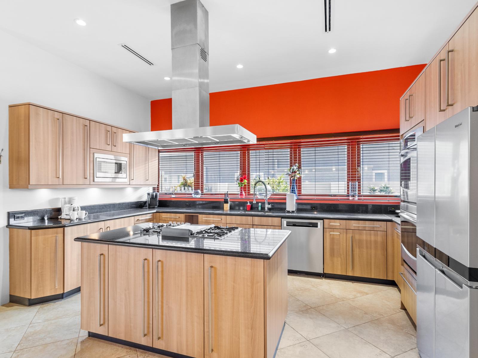 Vibrant pops of color are peppered throughout the kitchen
