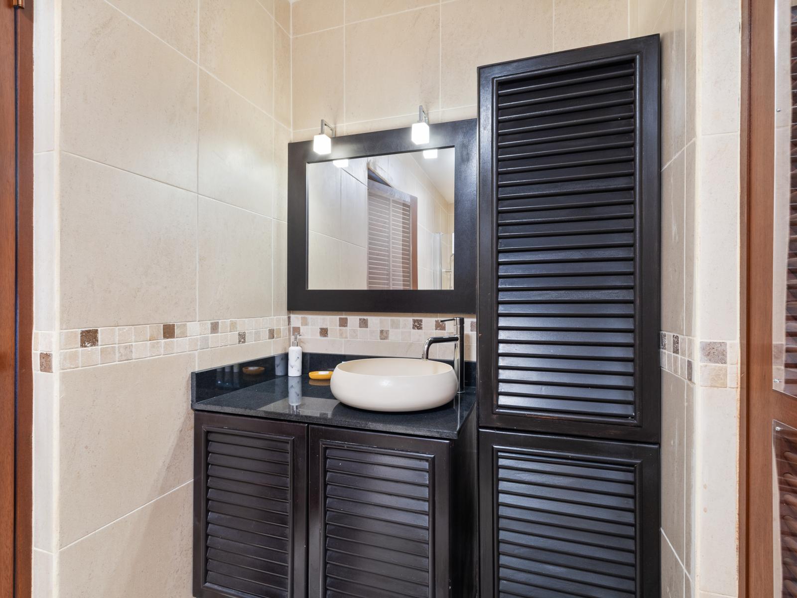 Unwind in the third bedroom's bathroom, where a luxurious bathing experience awaits you.
