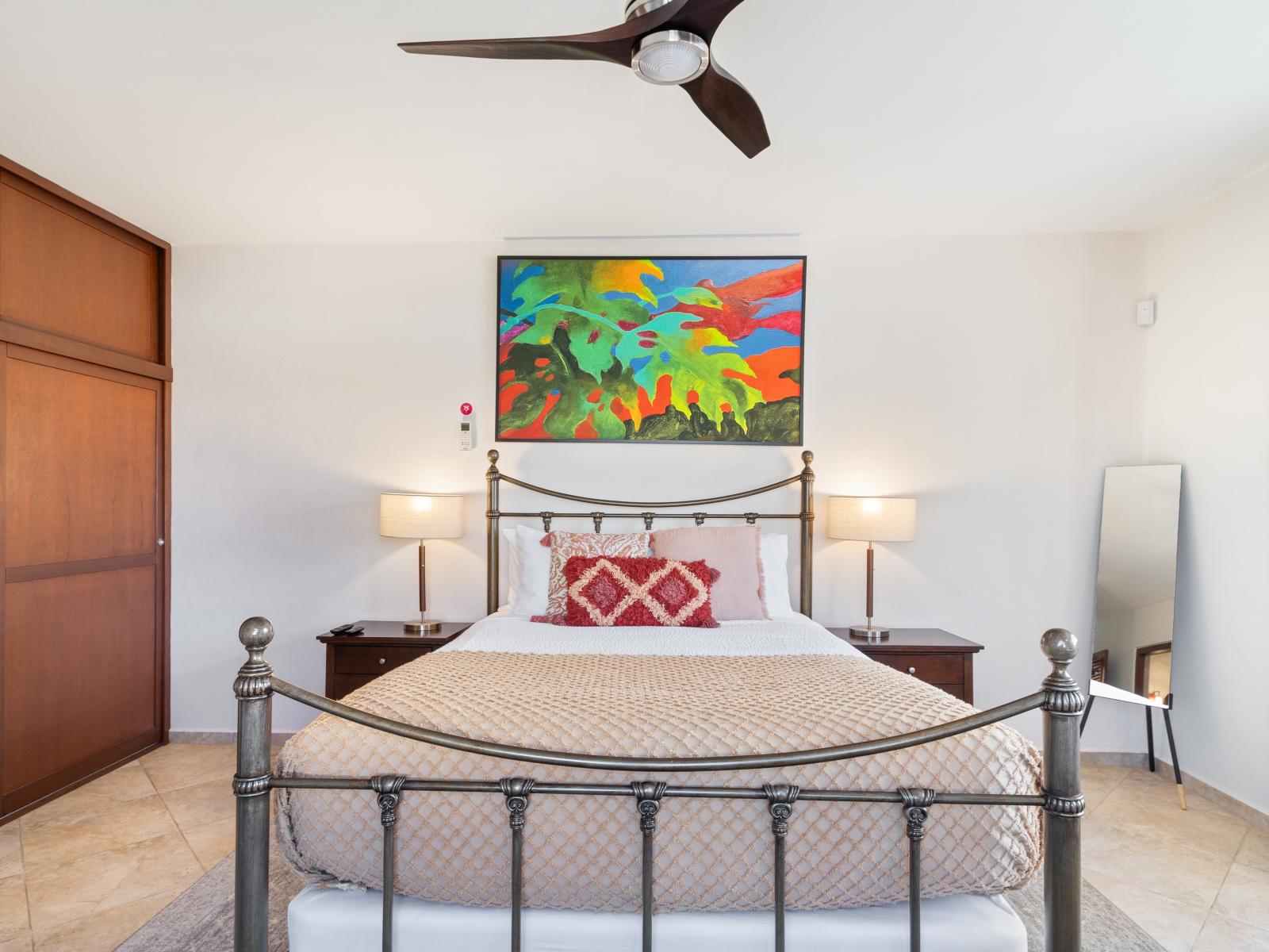 Enjoy comfort and privacy in the fourth bedroom, featuring a queen bed and its own ensuite bathroom.