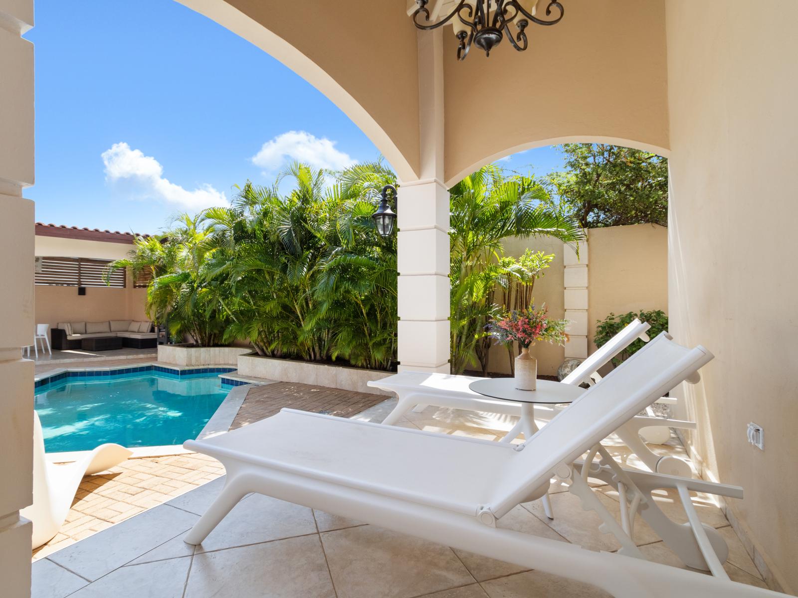Refresh and unwind: our pool with a stylish lounge area invites you to relax and soak up the sun.