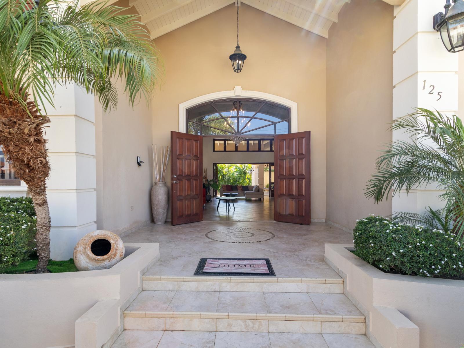 Experience the magic of arrival: our villa entrance greets you with warmth and elegance.