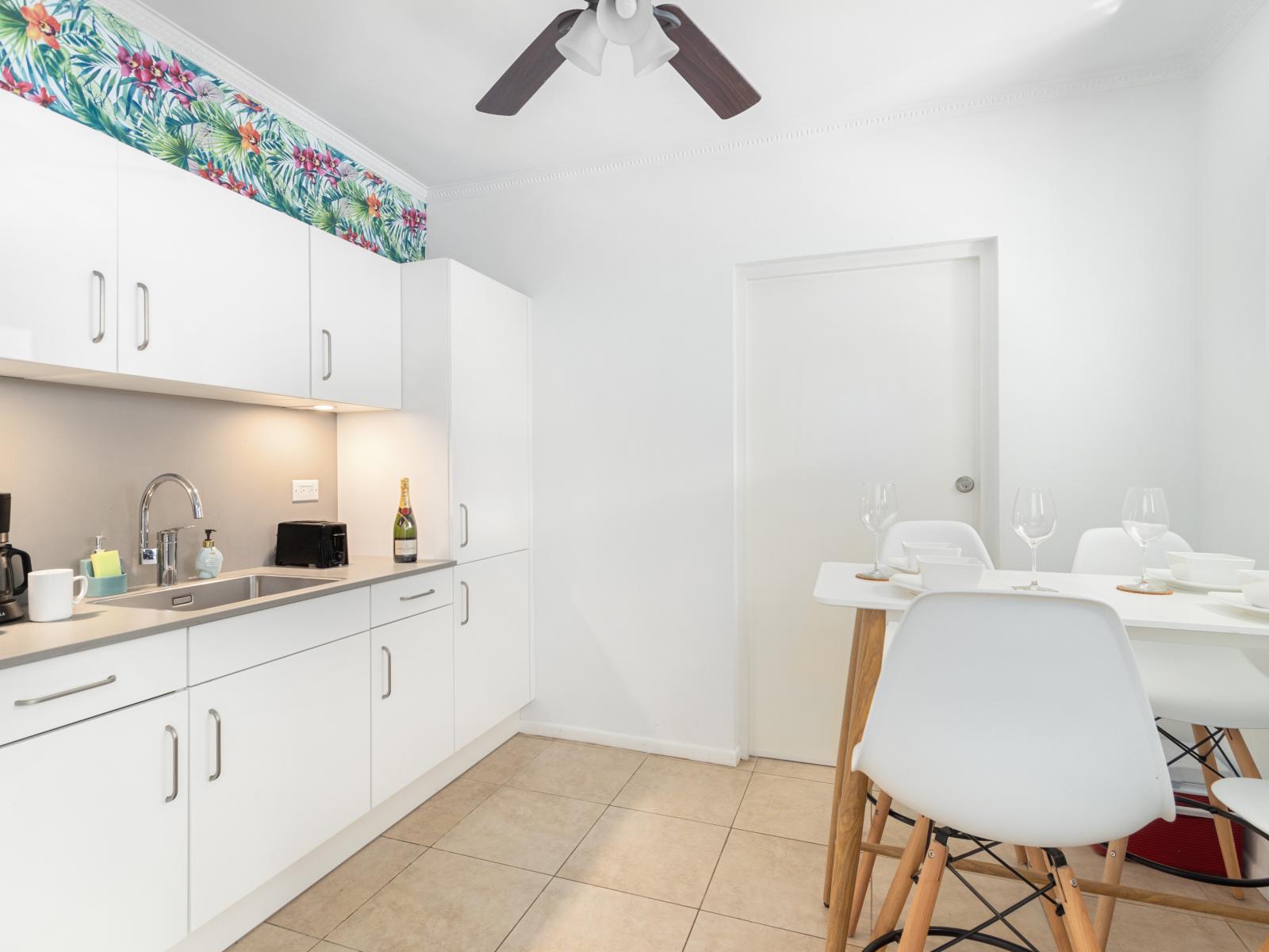 Chic Kitchen of the 2BR condo in Noord Aruba - Fully Equipped - Smart use of space with versatile storage solutions -  A kitchen that seamlessly combines style, functionality, and convenience