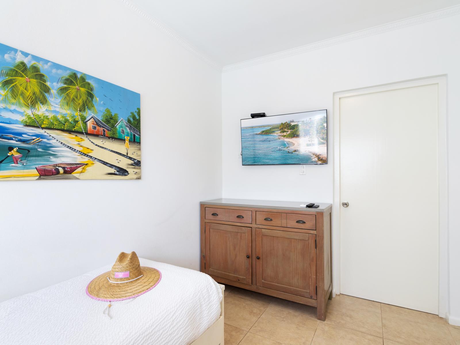 Sophisticated Bedroom of the 2BR condo in Noord Aruba - Smart TV and Netflix - Luxurious bedding for a restful night's sleep - Then Bathroom - Twin Bed