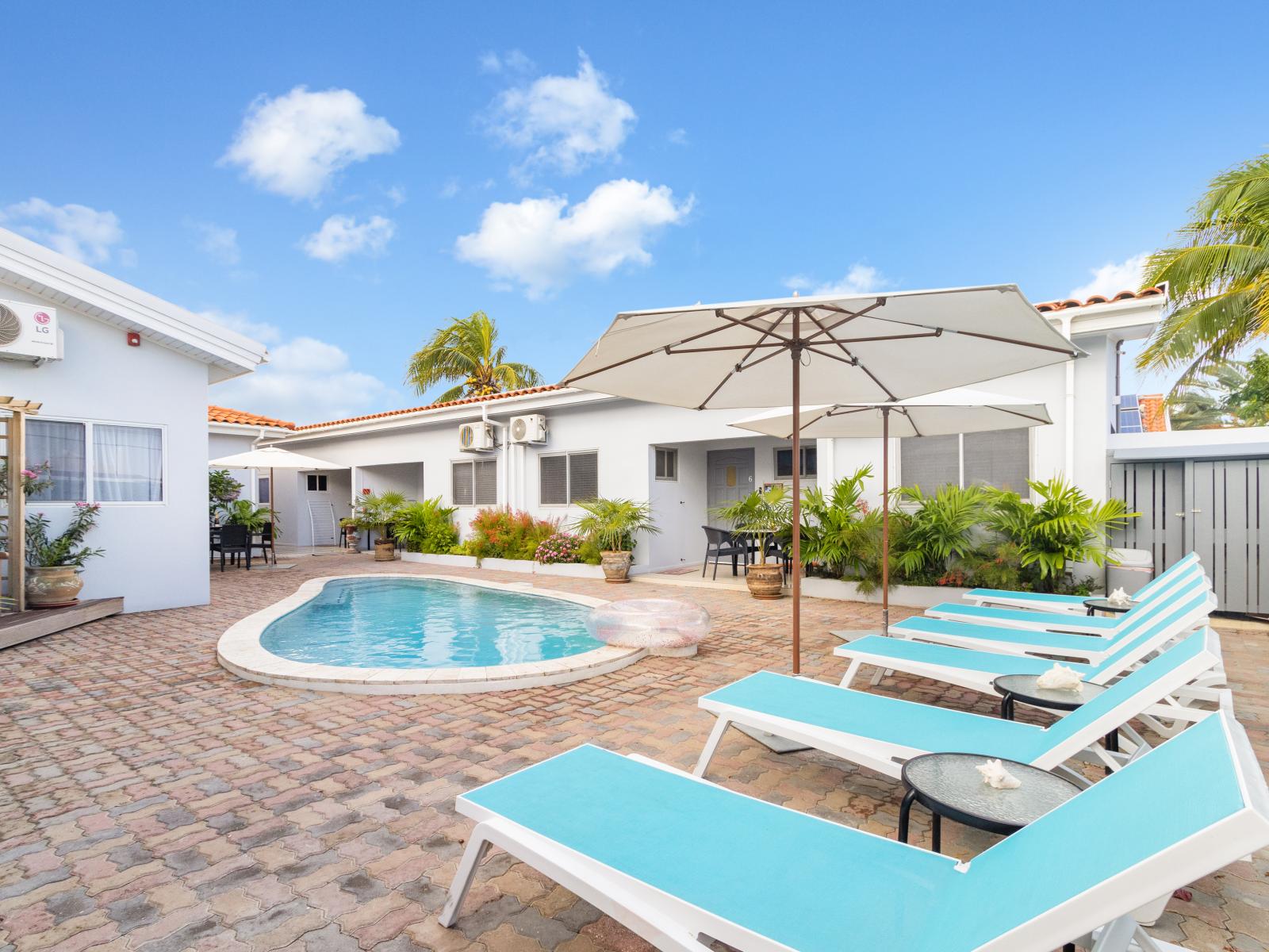 Awesome Shared Pool of the Apartment in Noord Aruba - Dive into refreshing poolside escape - Immerse yourself in the cool elegance of our pool - Experience ultimate relaxation in our poolside paradise