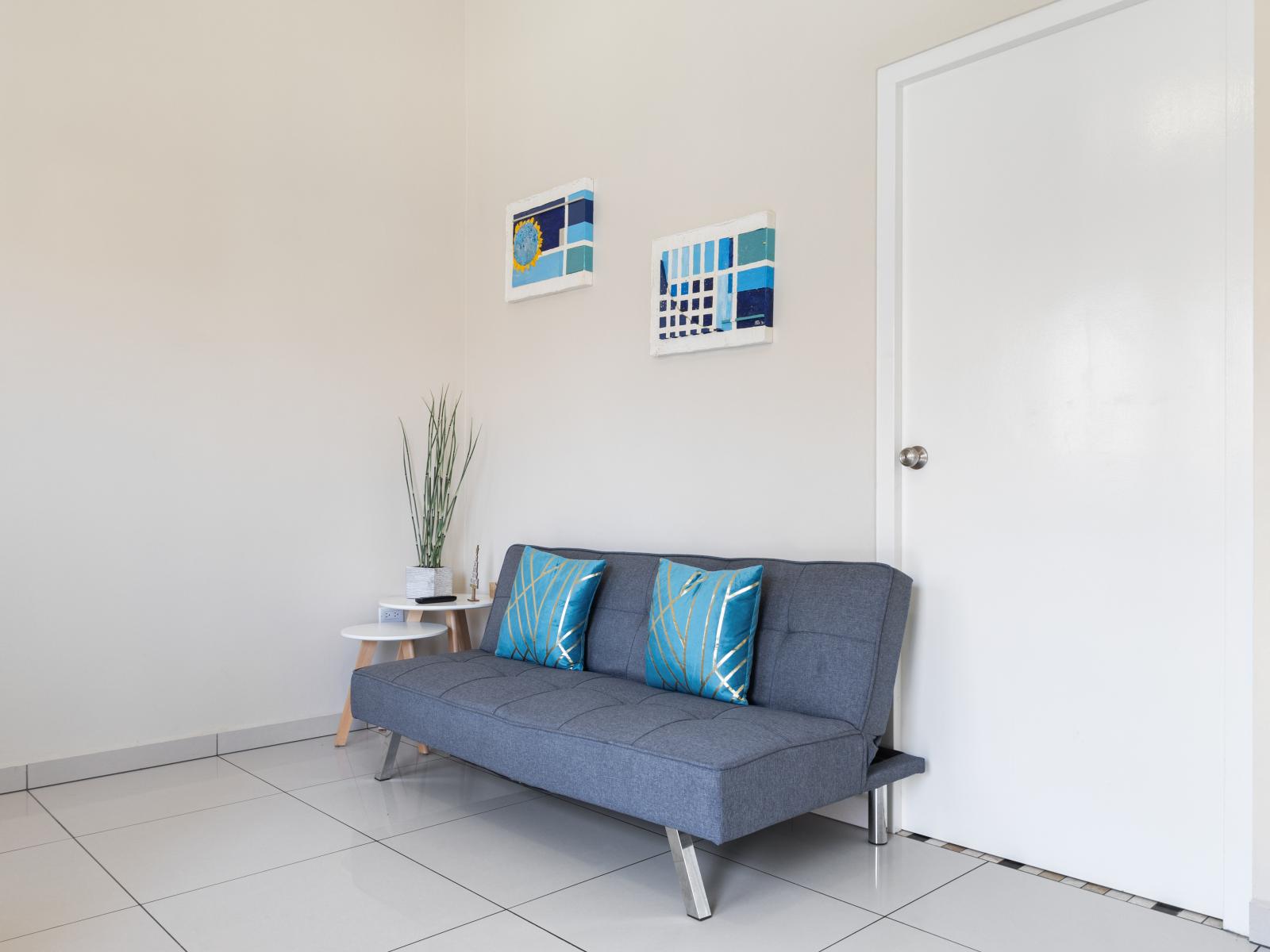 Elegant Living Area of the Apartment in Nood Aruba - Smart TV and Netflix - Comfy Sofa - Harmonious color scheme with pops of accent colors for visual interest