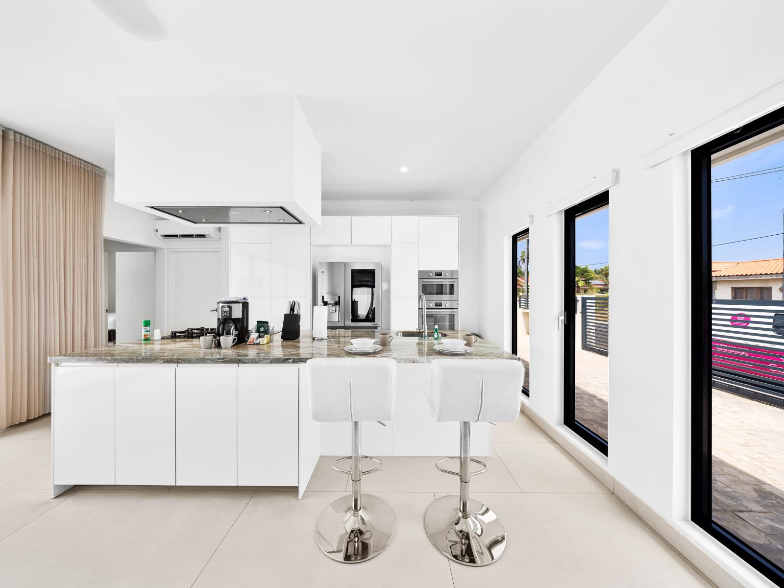 Fully Equipped Kitchen of the home in Noord, Aruba - Availability of stainless steel appliances and all necessary kitchen accessories - Plenty of space to store goods  - Big and bright windows with outside views