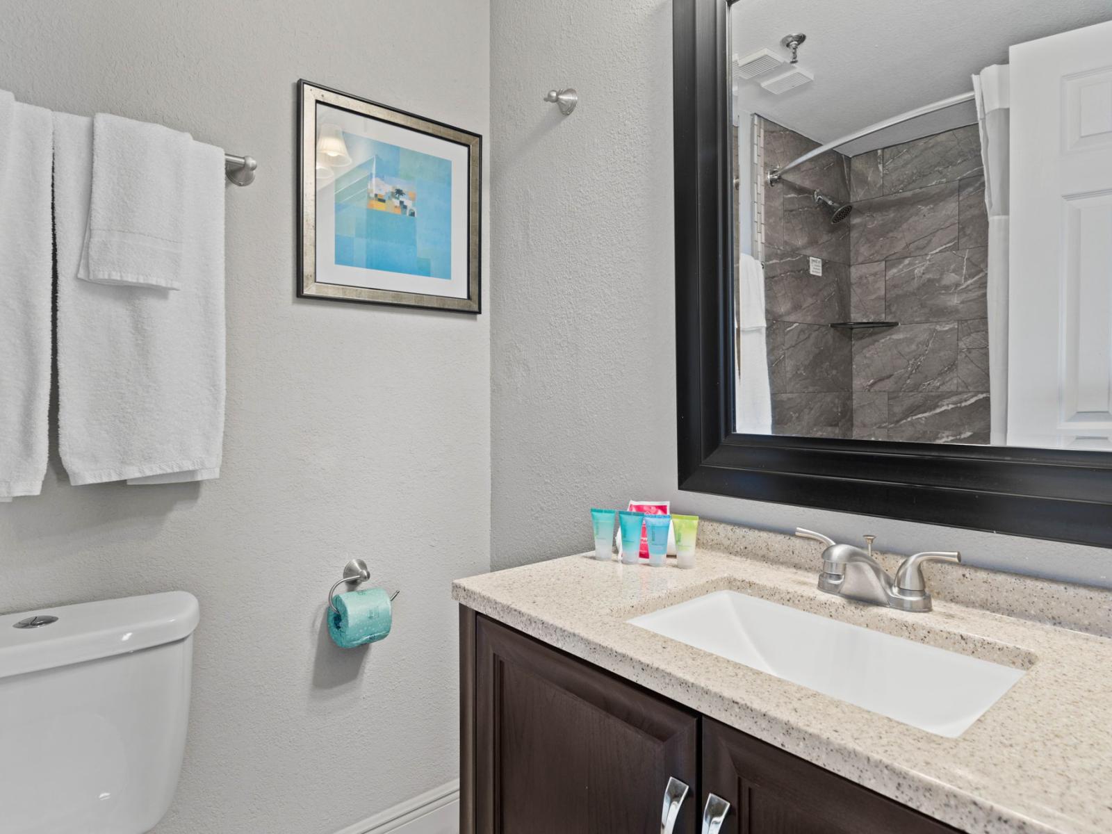 Bathroom 2 with a bathtub and a shower combo