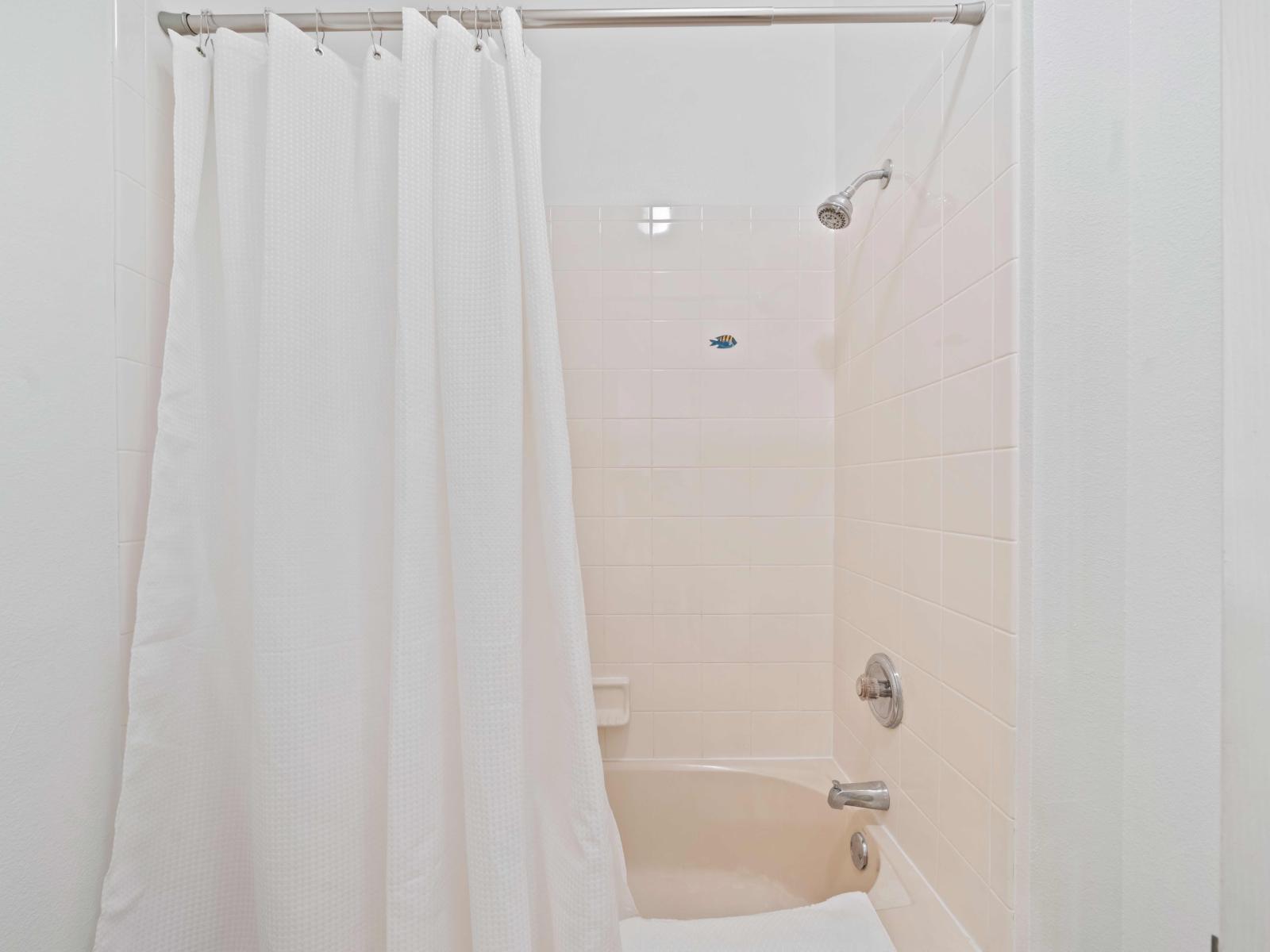 Bathroom 2 with a bathtub and shower combo