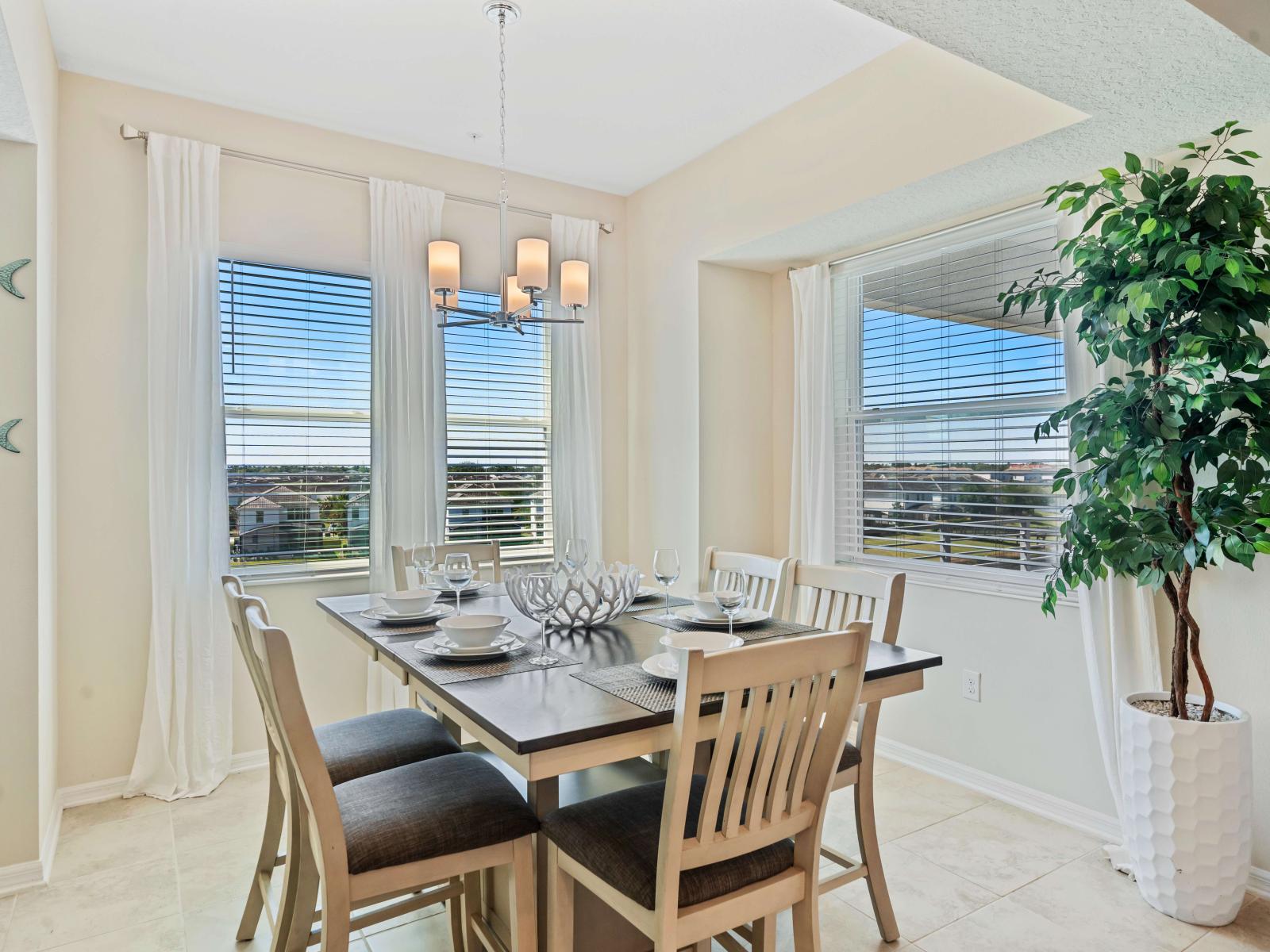 Marvelous dinning area of the apartment in Kissimmee - Beautiful window facing dinning area of the apartment - Elite 6 persons dinning - Stunningly located large windows with mesmerizing views - Majestic decored space with beautiful paintings