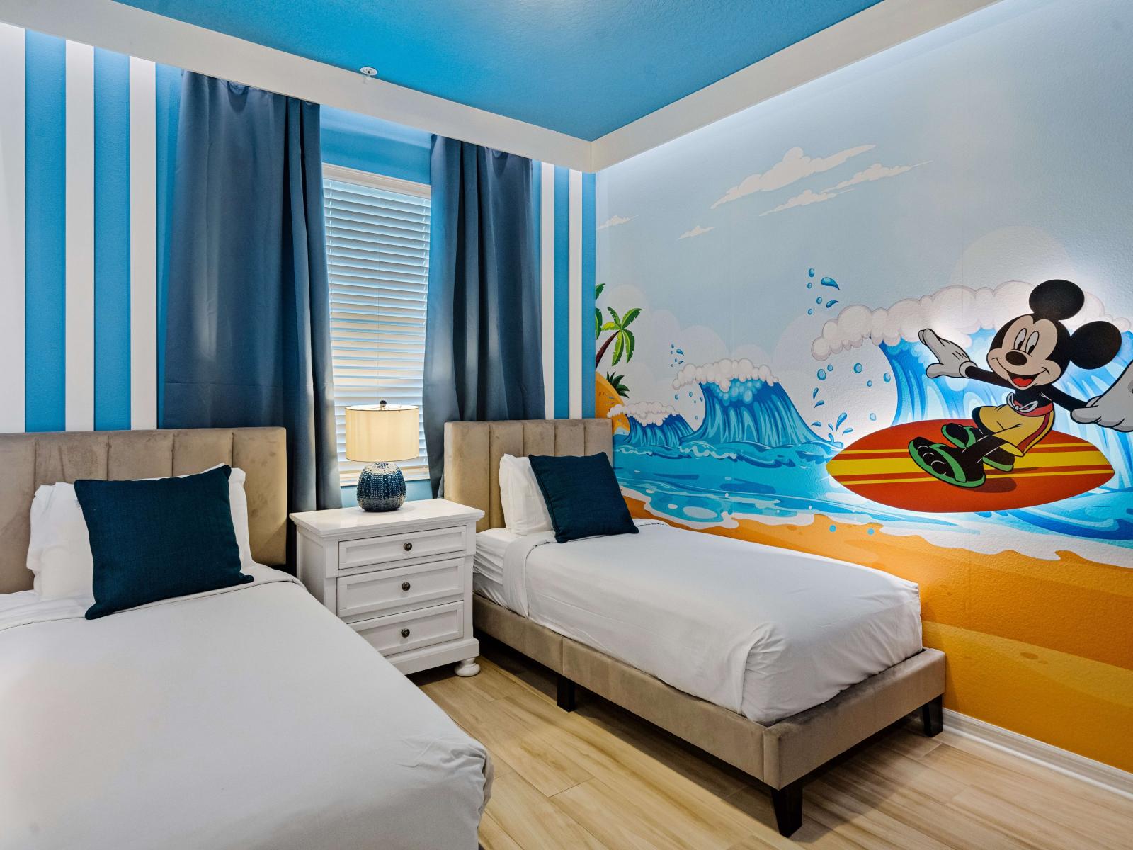 Experience the magic of Disney with our Mickey-themed room, complete with two cozy single beds. - Stunning wardrobe with sufficient space - Enjoy the Availability of Smart Tv and Netflix - Indulge in mesmerizing views from the windows of the room