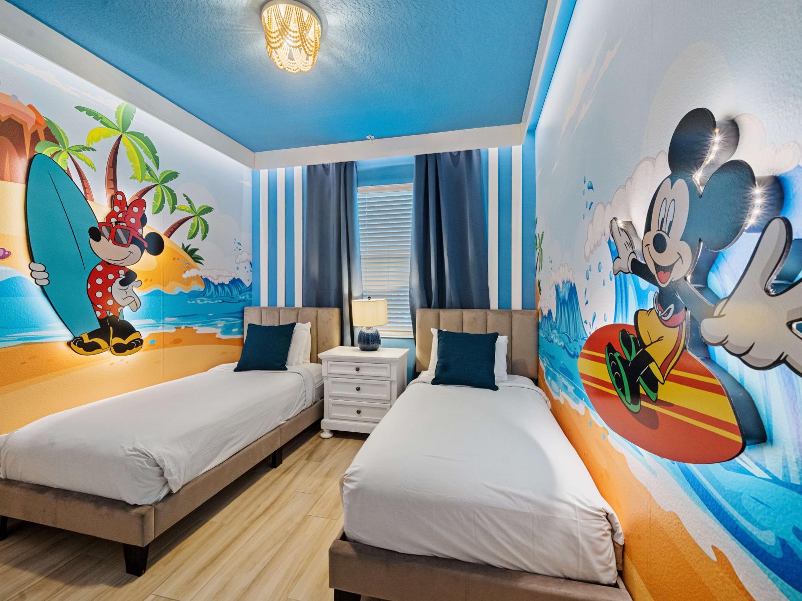 Experience the magic of Disney with our Mickey-themed room, complete with two cozy single beds. - Stunning wardrobe with sufficient space - Enjoy the Availability of Smart Tv and Netflix - Indulge in mesmerizing views from the windows of the room