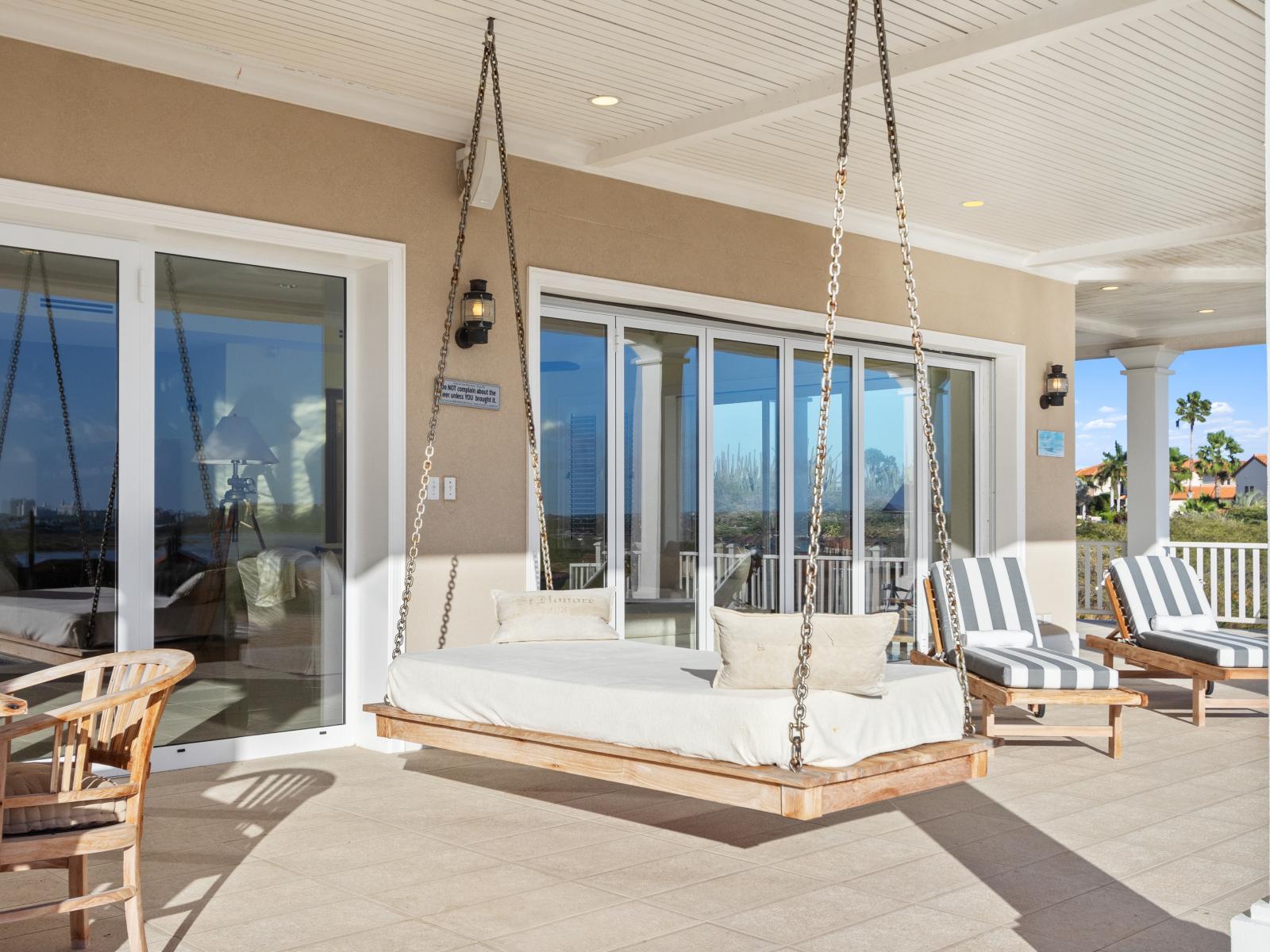 Swinging into serenity on our patio swing sofa – where comfort meets the gentle sway of relaxation, creating a perfect haven for lazy afternoons and tranquil evenings.