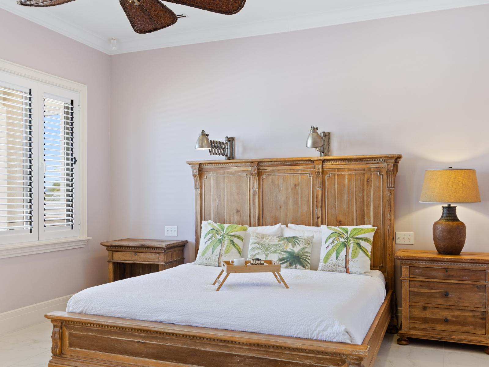 Experience a tropical paradise in our first-floor bedroom, featuring a king-sized bed and ensuite bathroom for ultimate comfort and convenience