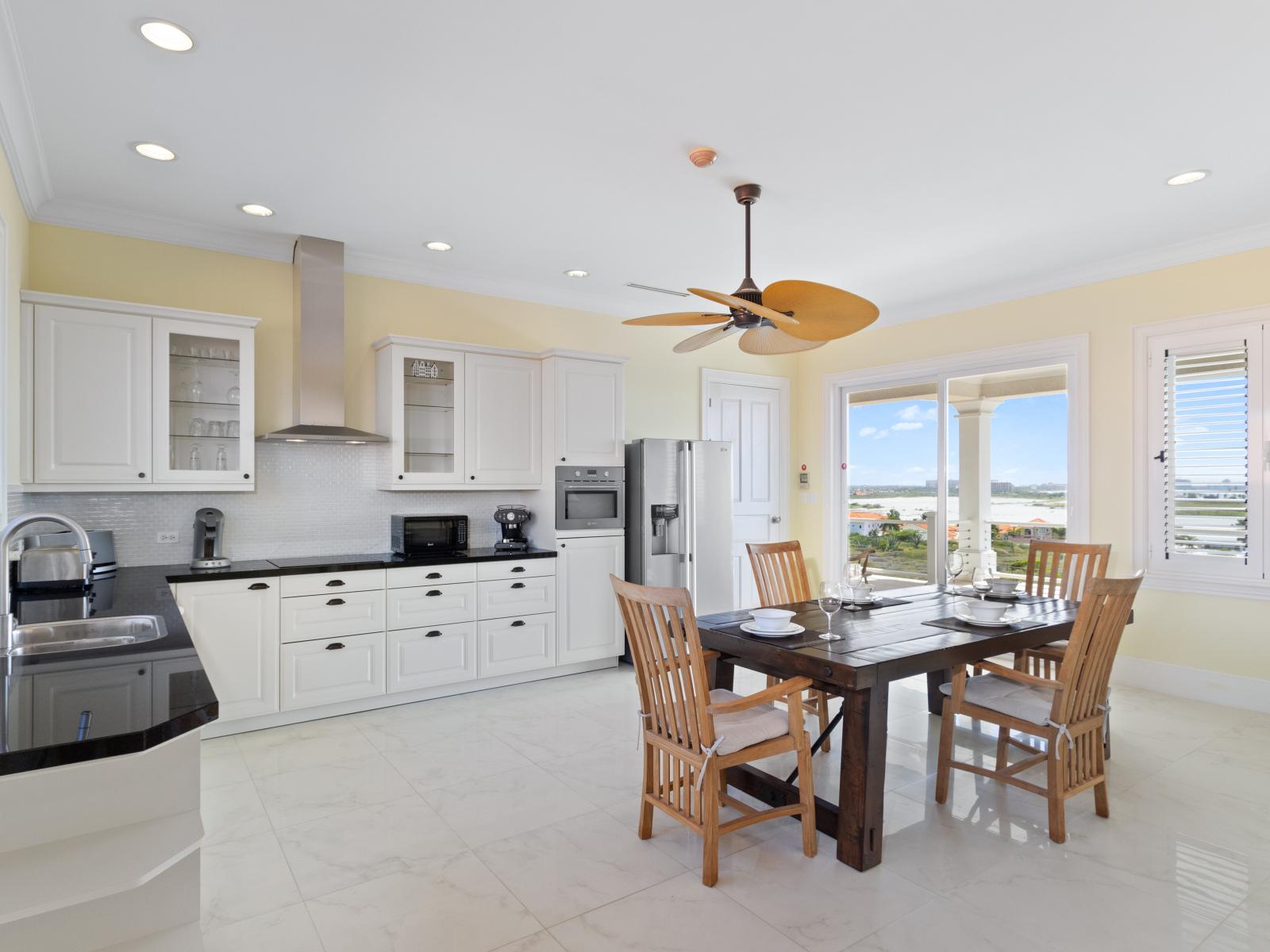 Second kitchen on the 2nd floor with a dining table for convenient and cozy meals.