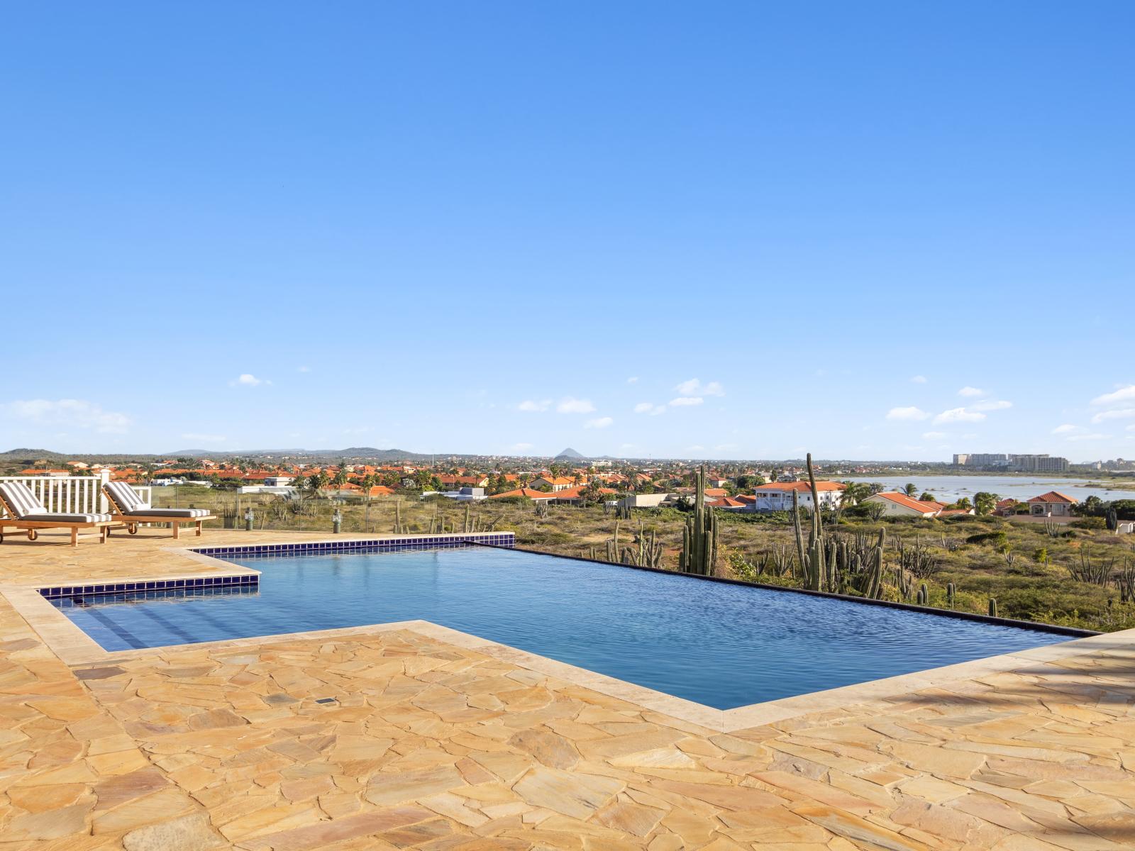 "Unobstructed views from the infinity pool, offering breathtaking scenery.