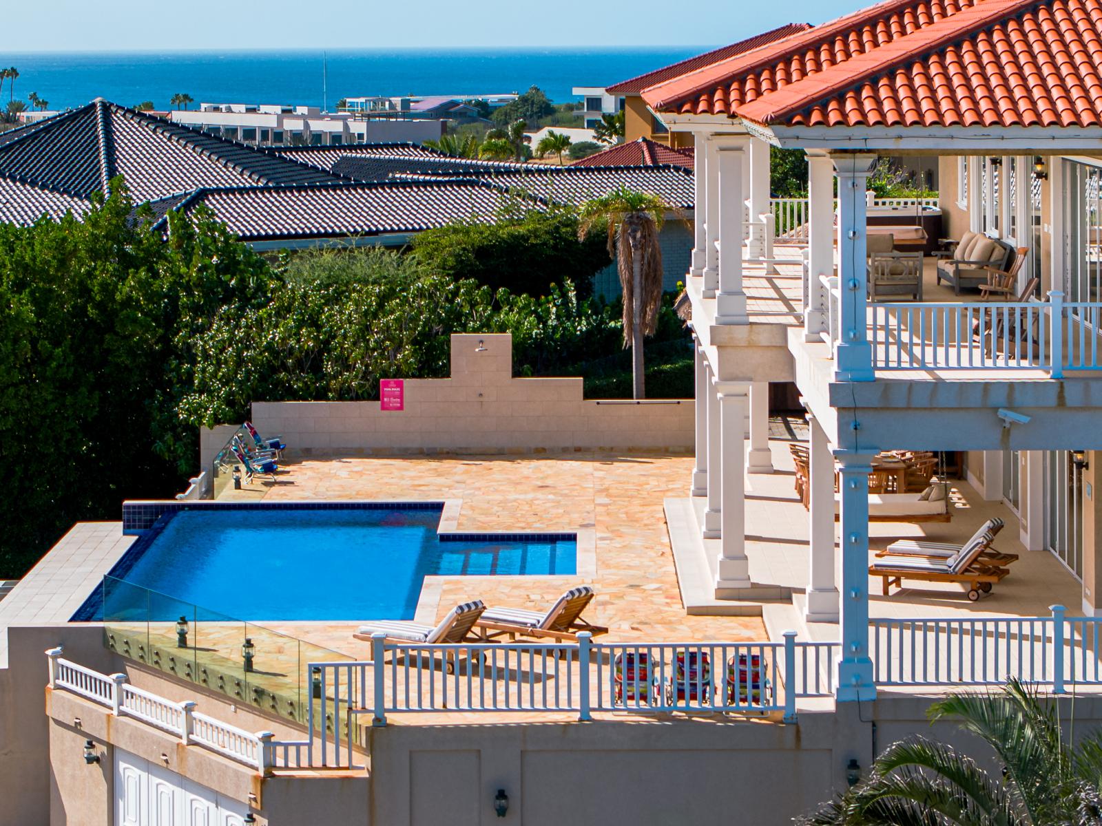 Relax on the beautiful flagstone pool deck, perfect for enjoying sunny days and evening gatherings.