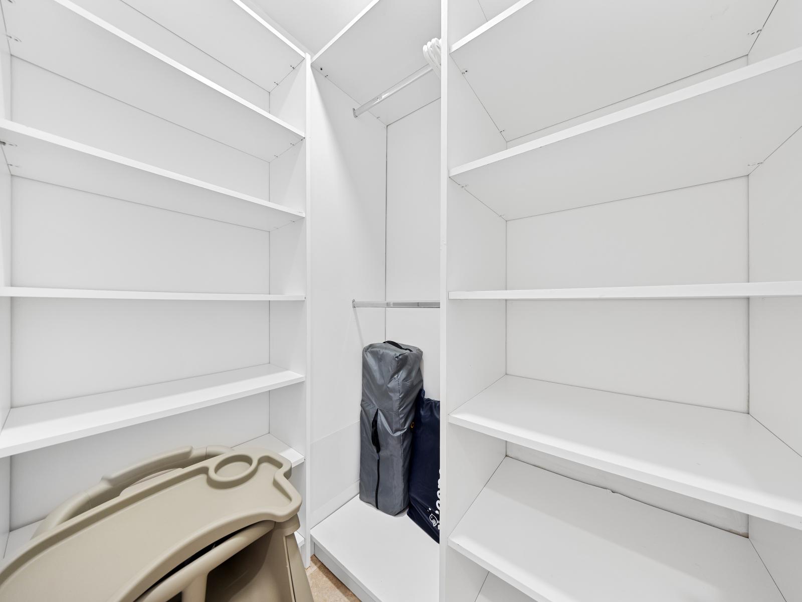 A spacious walk-in closet  - Adorned with a versatile storage solutions - Plenty of shelving space for all of your belongings