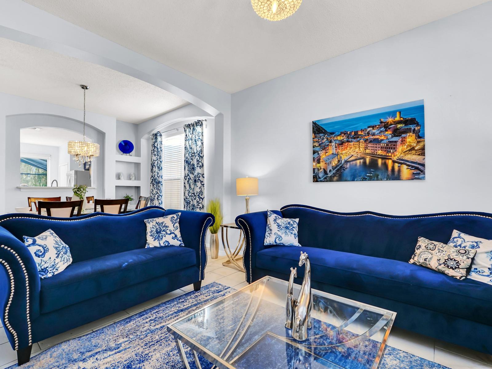 Radiant Living Area of the Home in Kissimmee Florida - The living room Is the perfect place to gather and share stories after a day of exploration - Cozy seating area conducive to relaxation and socializing