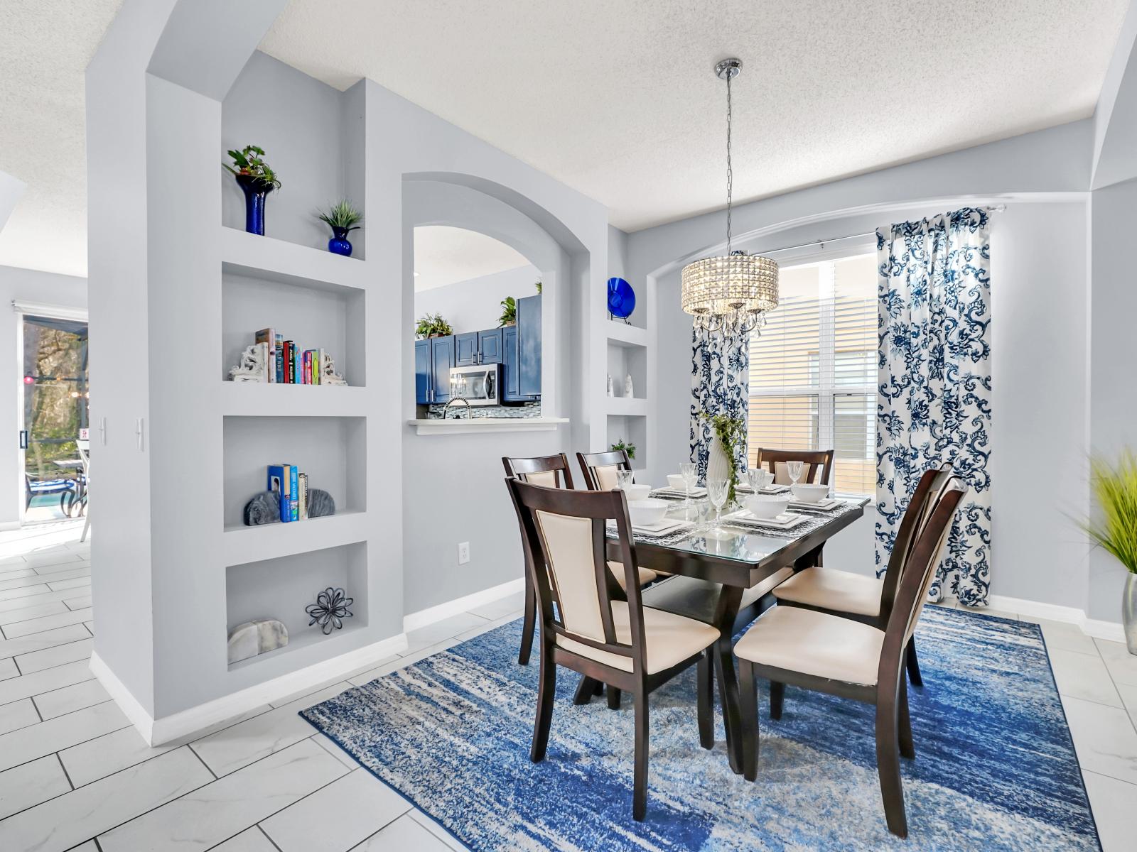 Opulent Dining Area of the Home in Kissimmee Florida - Experience opulence in our luxurious dining area - Adjacent to the living area, creating a seamless flow for sophistication - Persons Dining