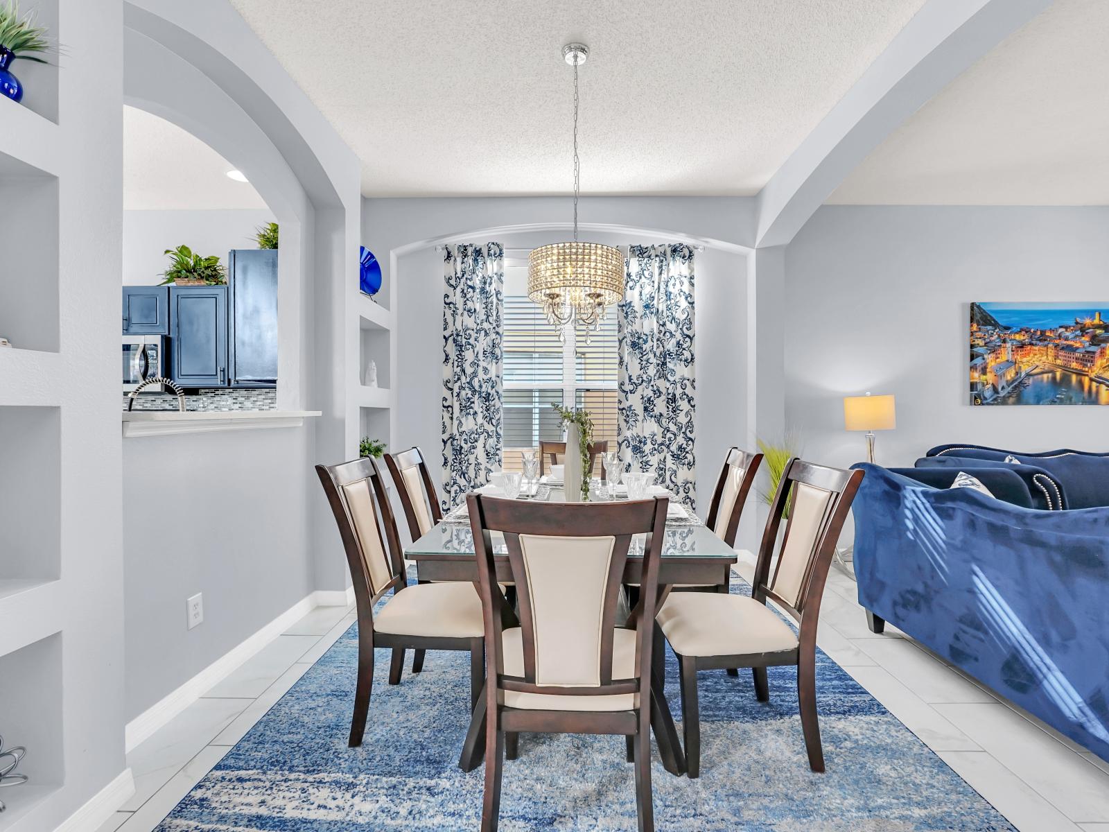 Luxury Dining Area of the Home in Kissimmee Florida - 6 Persons Dining - Thoughtful lighting fixtures creating an intimate and inviting atmosphere - Lots of art work and beautiful furnishings throughout the home