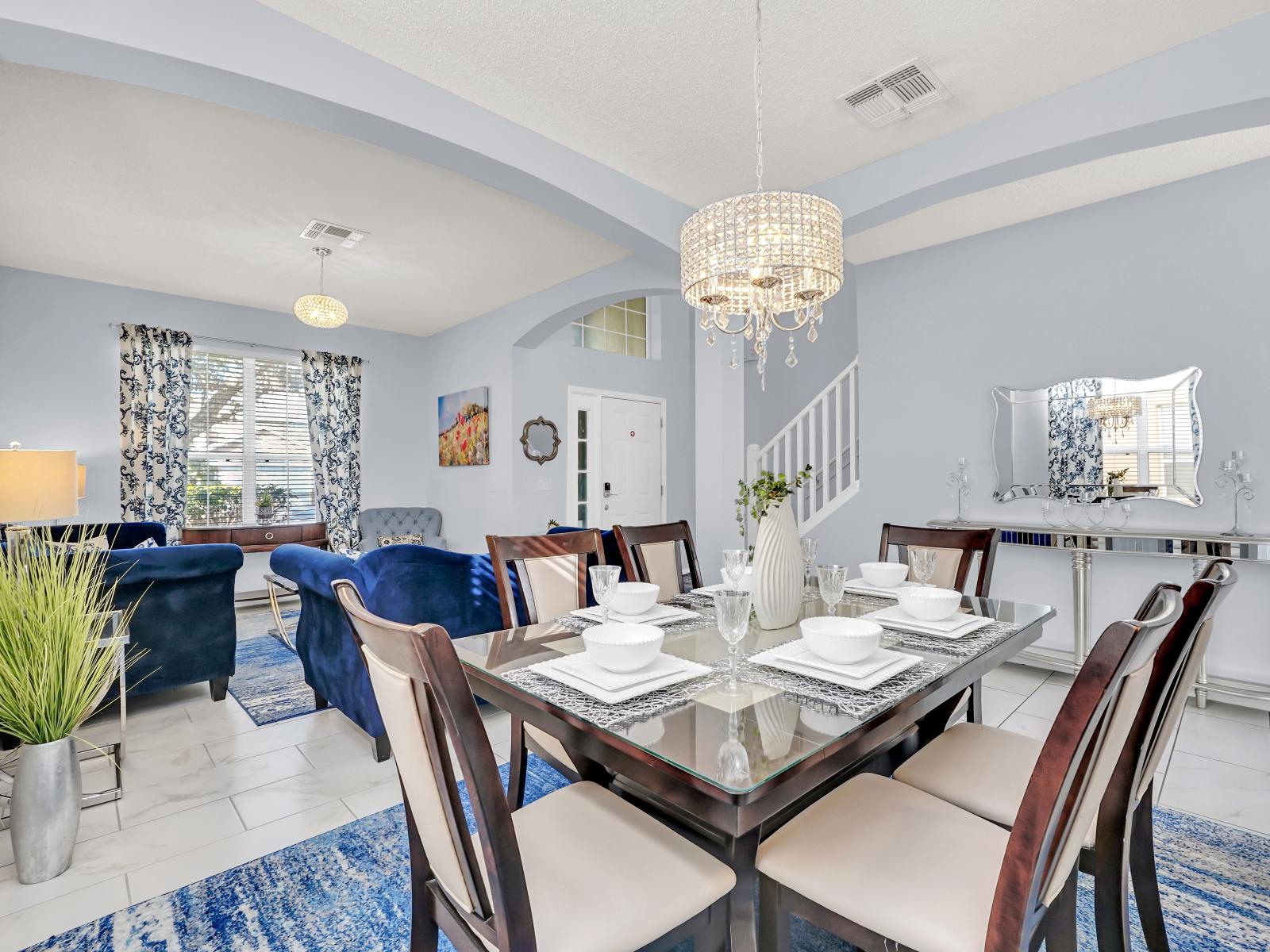 Charming Living Area of the Home in Kissimmee Florida - 6 Persons Dining - Quality materials, such as a sleek dining table and comfortable chairs - Modern Design - Intimate ambiance created through soft, ambient lighting