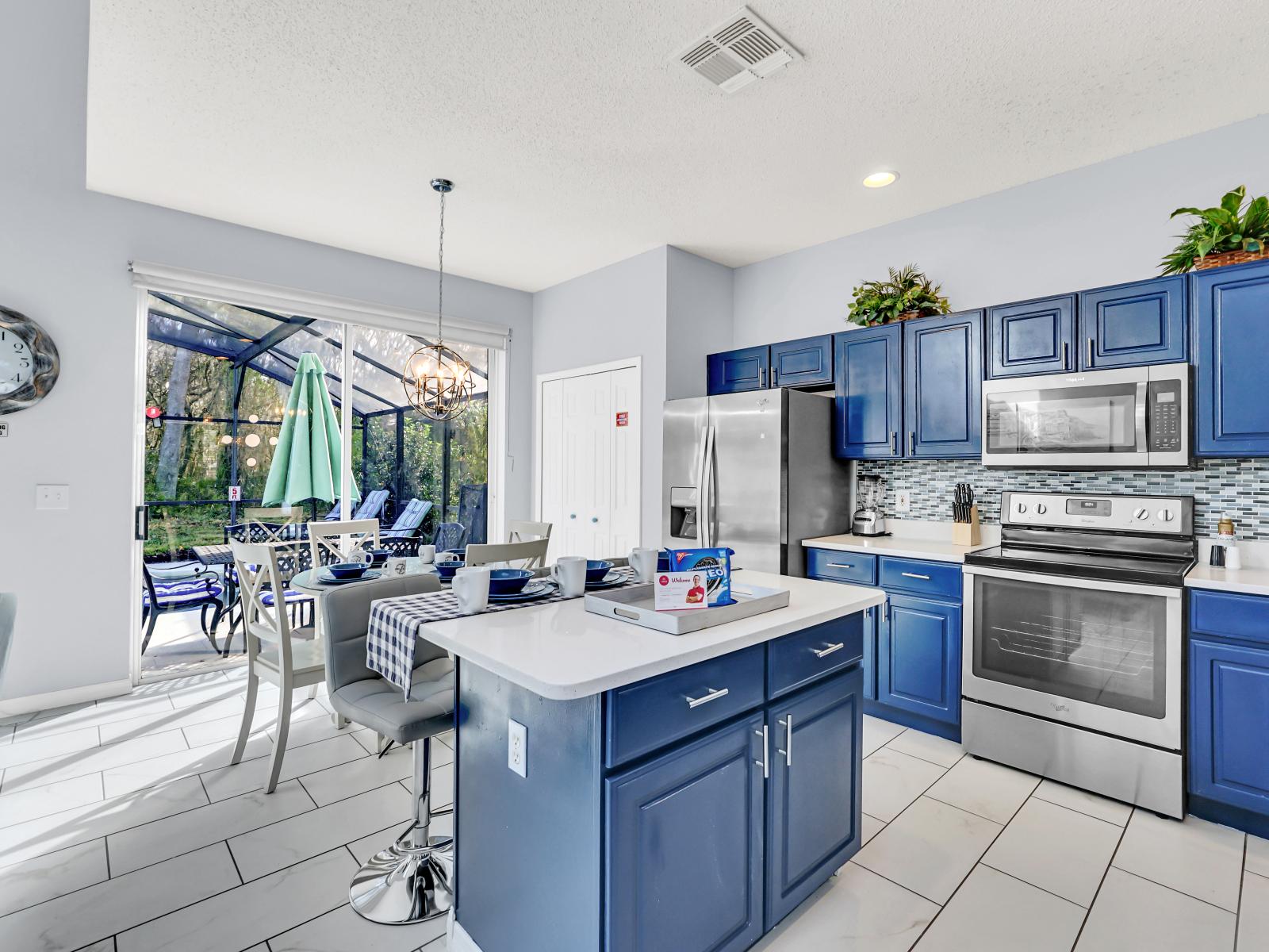 Picturesque Kitchen of the Home in Kissimmee Florida - Fully equipped kitchen - Creates a harmonious and inviting atmosphere - High Chairs and Breakfast bar