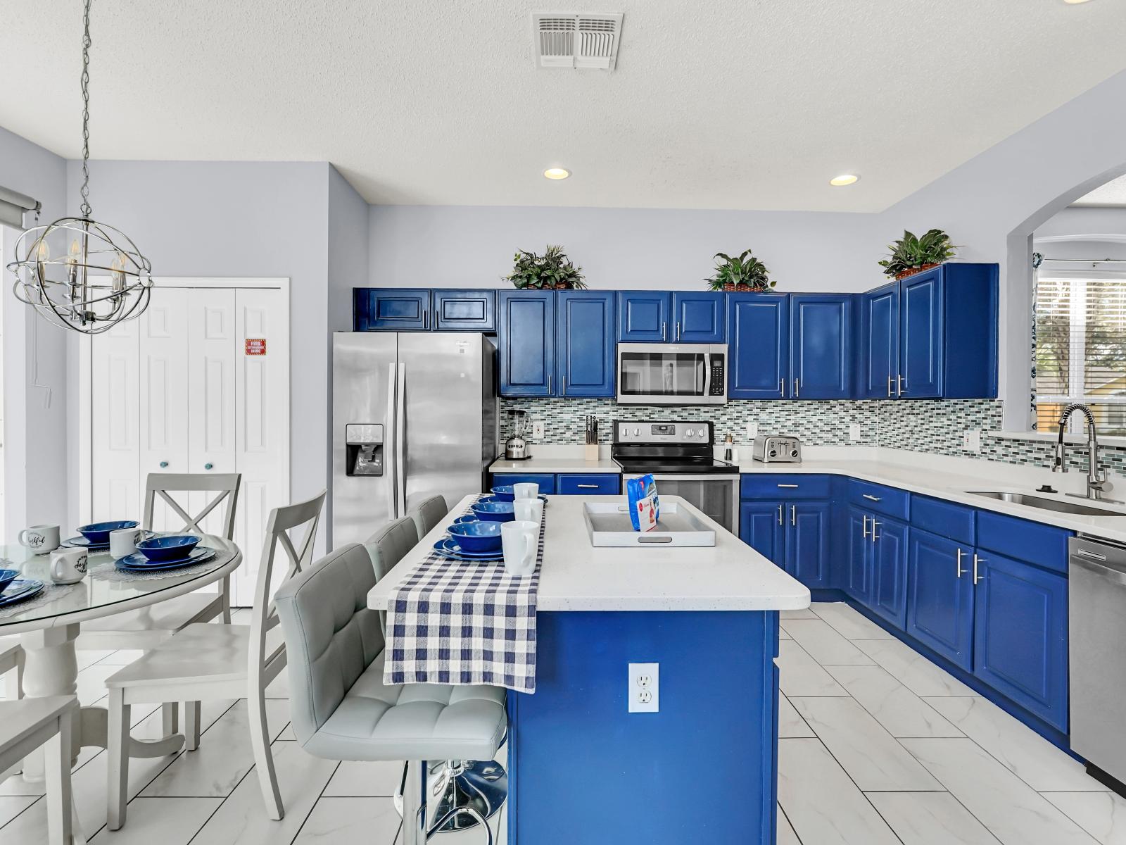 Elegant Kitchen of the Home in Kissimmee Florida - Open concept provides a picturesque setting for your culinary adventures - Surrounded by tasteful furnishings and modern amenities