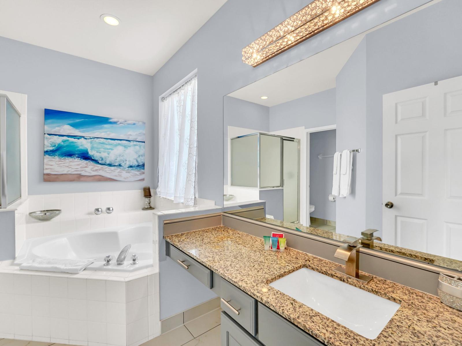 Lavish Bathroom of the Home in Kissimmee Florida - Amazingly decored - Chic dual vanity with large mirror - Elegant bathroom with luxurious fixtures and finishes - Upscale lighting