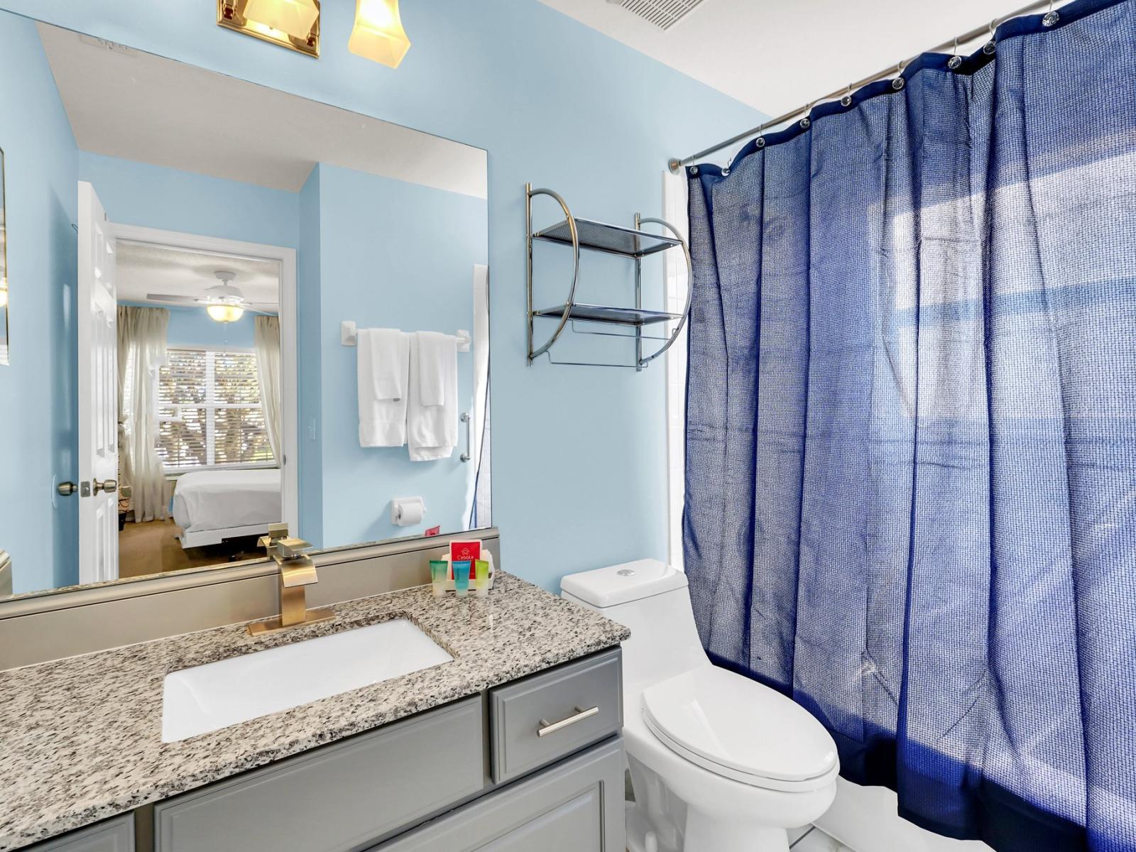 Chic Bathroom of the Home in Kissimmee Florida - Superb Bathtub and a shower combo - Sliding Curtains for added privacy - Chic Vanity with large mirror