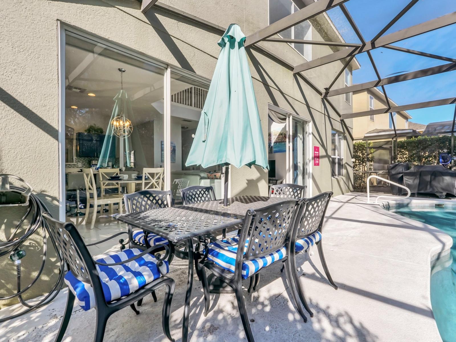 Lush Dining Area of the Home in Kissimmee Florida - Enjoy Al Fresco Dining - Unwind and Dine in our Outdoor Area by the Poolside