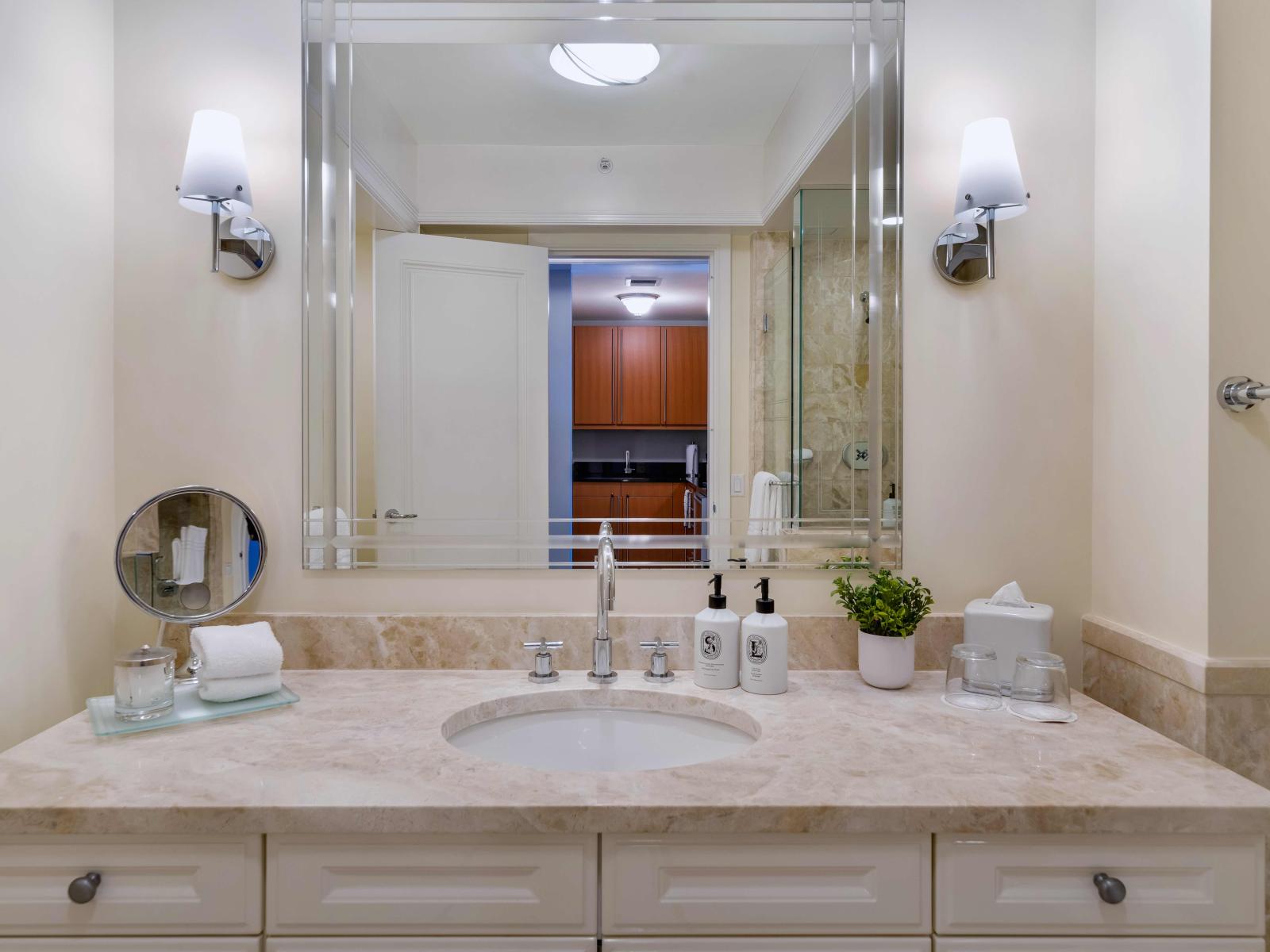 Pamper Yourself: Experience Blissful Comfort in Our Opulent Bathroom Complete with a Walk-In Shower and Deep Bathtub.