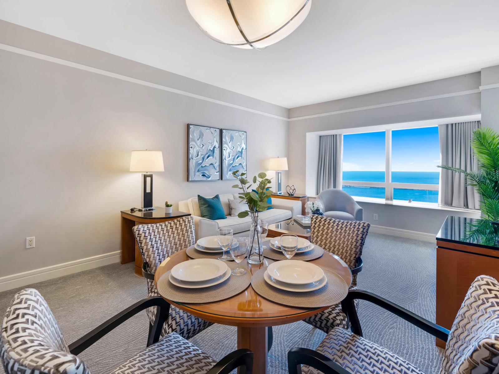 Urban Elegance: Experience dining with a view in this studio apartment's chic dining area. A tasteful setup that combines comfort with contemporary design, providing the perfect spot to savor your Miami culinary experiences.