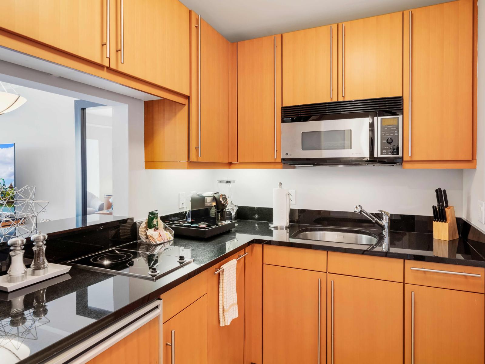 Modern Miami Kitchen Retreat: Step into this fully furnished kitchen, where modern design meets functionality. A stylish space that makes preparing meals a delight, ensuring your stay is as comfortable as it is luxurious.