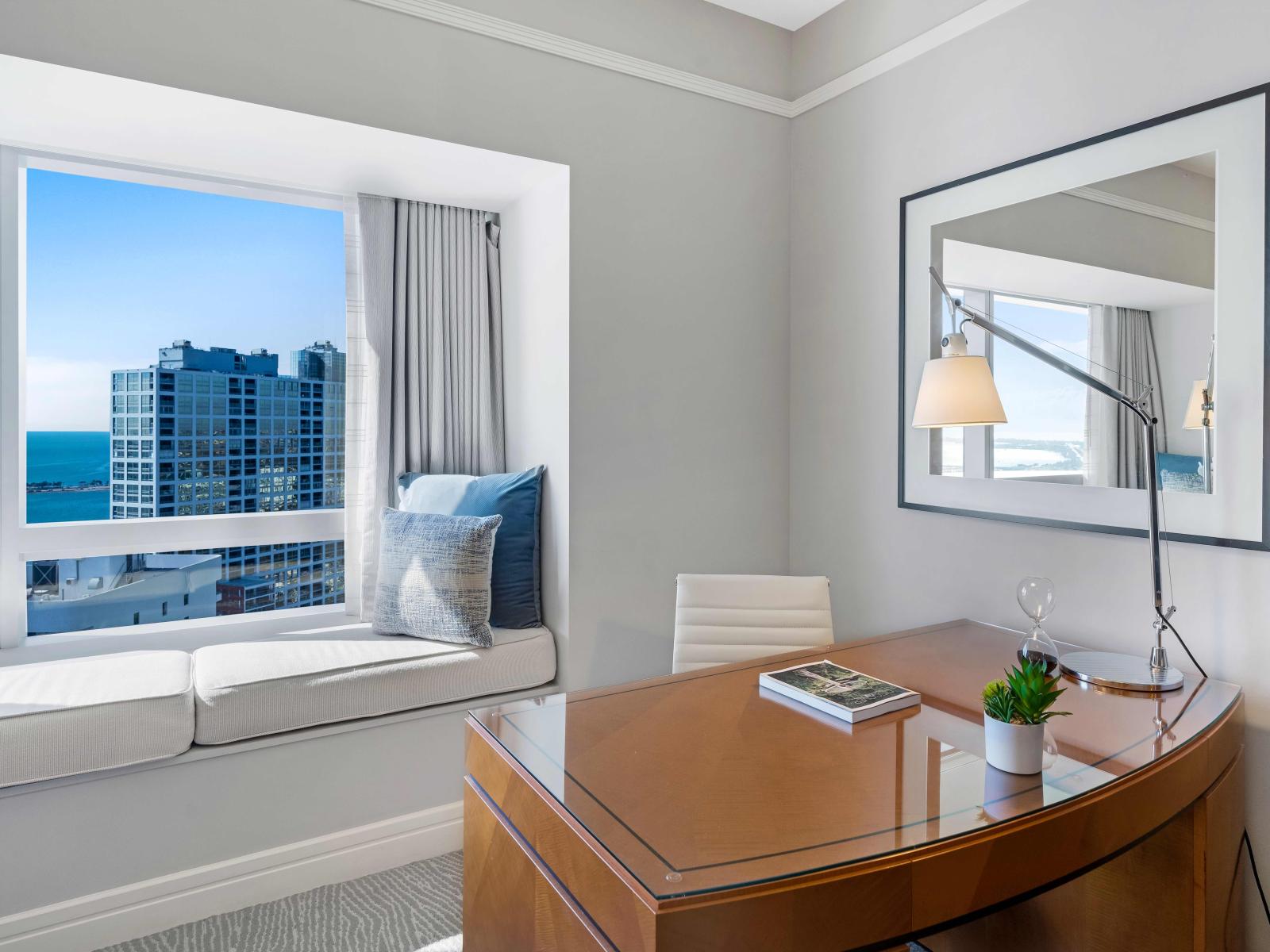 Seaside Serenity: Immerse Yourself in Comfort and Convenience in Our Bedroom Suite, Boasting Spectacular Ocean Views, a Plush King Bed, Smart TV, Attached Bathroom, and Work Desk.