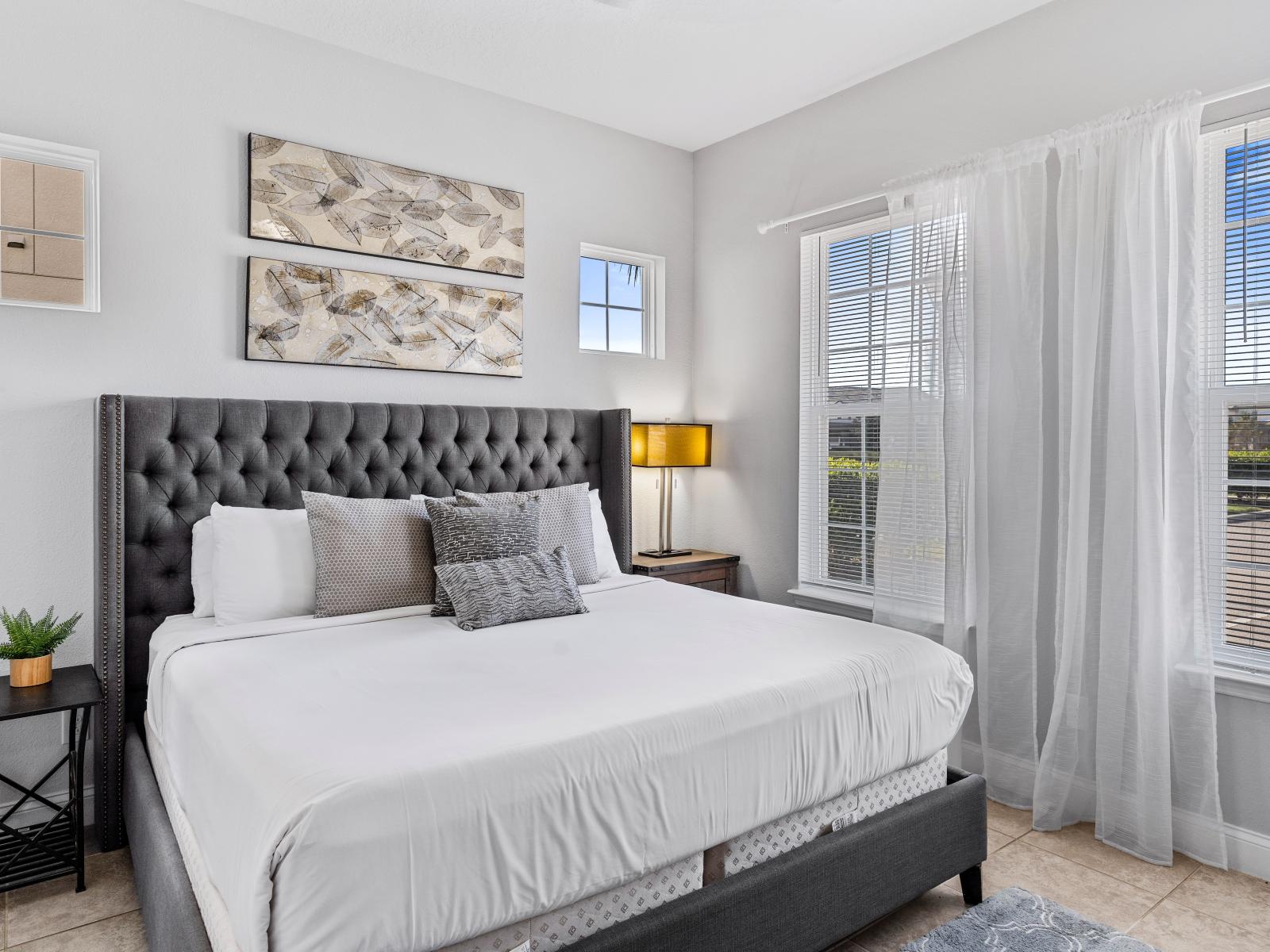 Luxe Bedroom of the Townhouse in Davenport Florida - Attached bathroom for convenience - Comfy Double bed - Stunning outside views