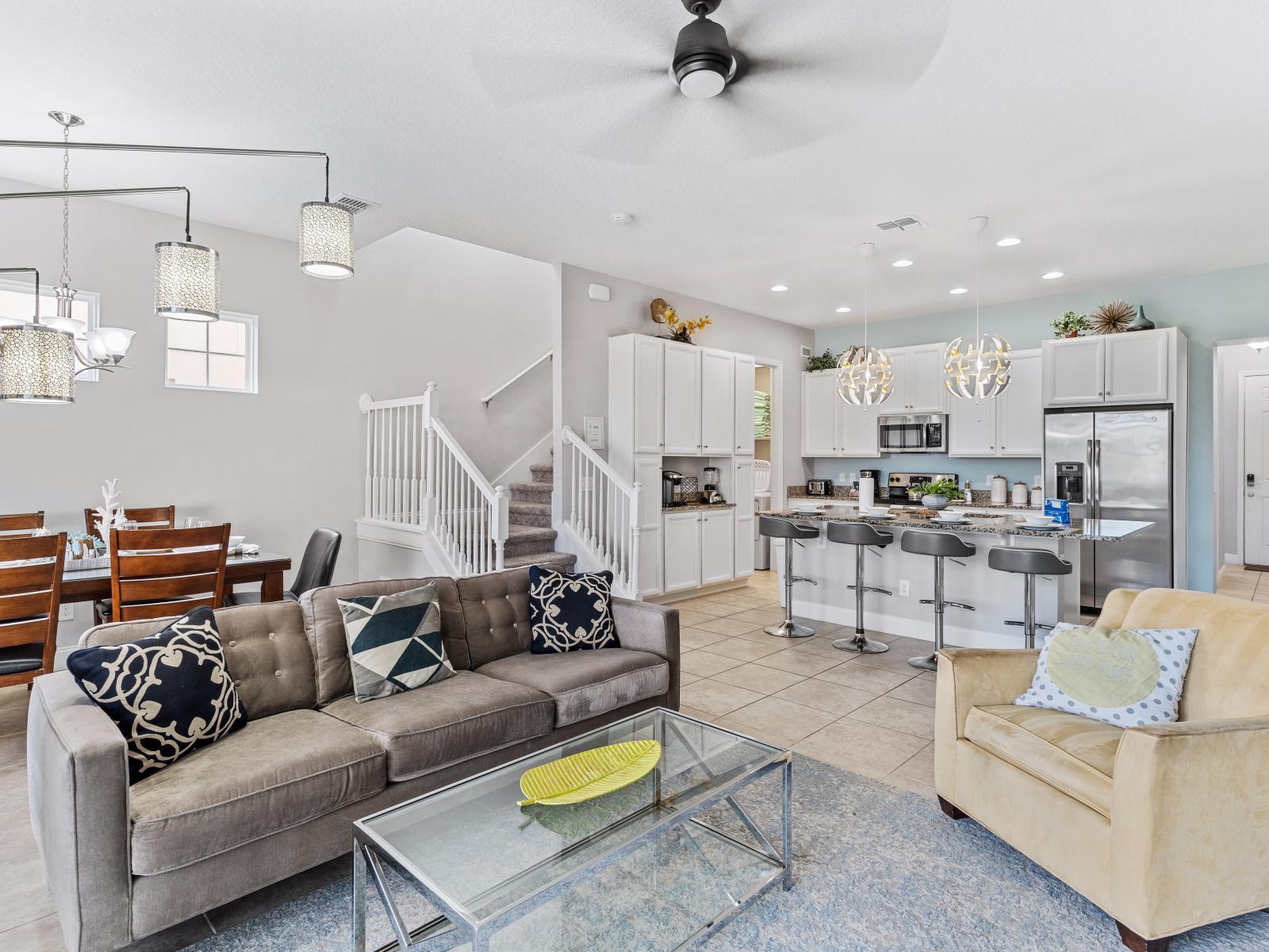 Beautiful Townhouse in Davenport Florida - Open layout seamlessly connecting the dining area to the kitchen and living room - Chic area with a statement lighting - Customized decor reflecting a sophisticated design sensibility