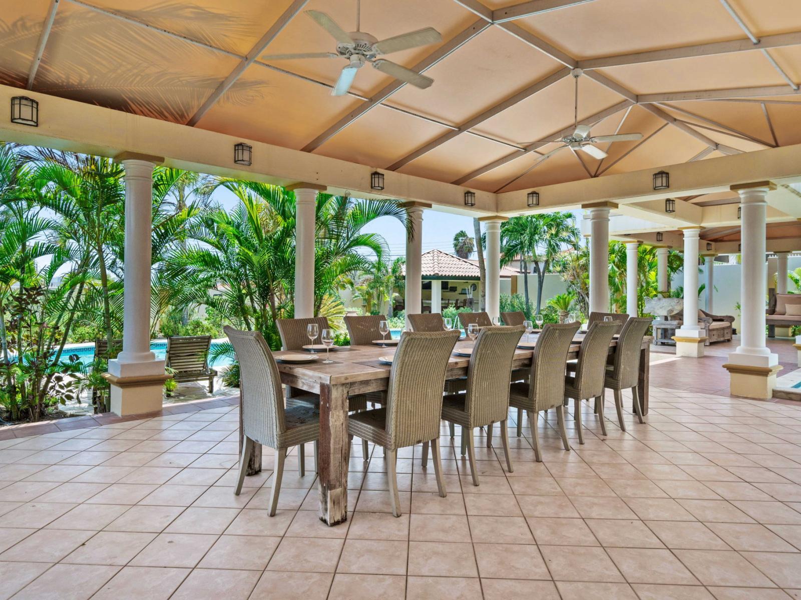 Large outdoor dining table by the pool