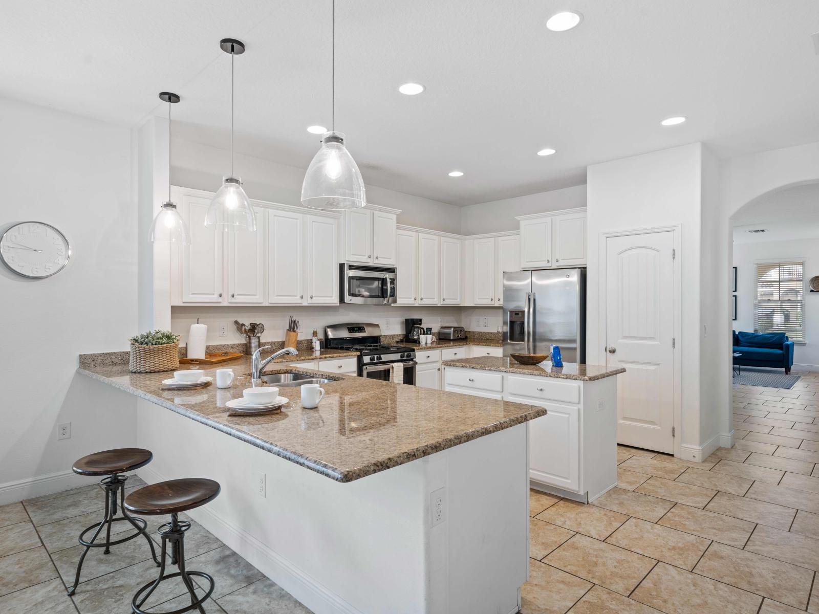 Open-Plan Full equipped kitchen of the home in Davenport - Sufficient storage space - Plenty space to walk and work according to your ease - Availability of all necessary kitchen accessories - Stunningly tiled floor