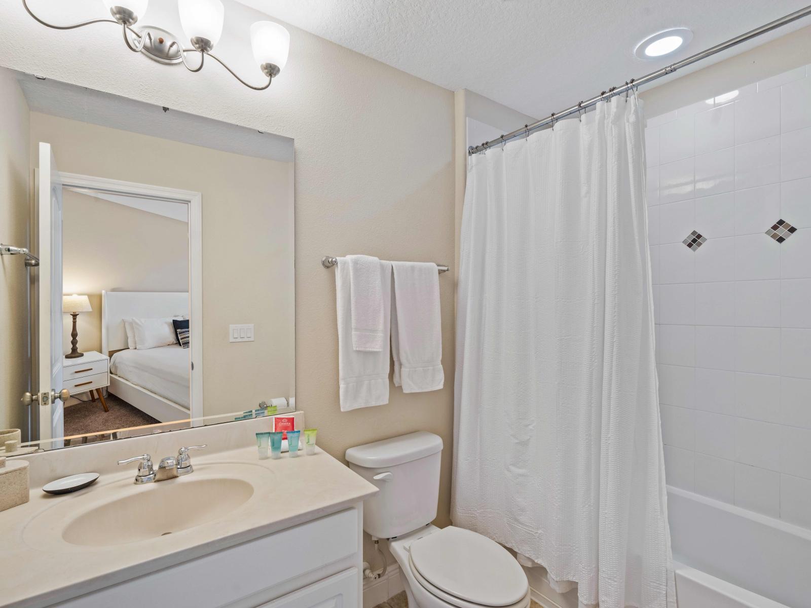 Unwind and recharge in our sophisticated bathroom retreat of the home in Davenport - Pamper yourself in our spa-like bathroom sanctuary with Cozy bathtub and shower combo - A modern bathroom with neat toilet set and beautiful vanity