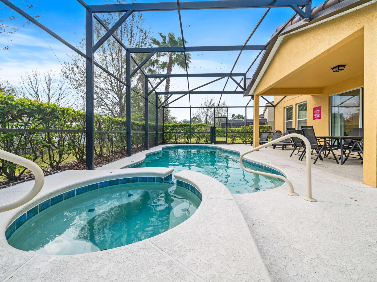 Dive into tranquility in our secluded pool and spa oasis of the home in Davenport. - Lounge by the poolside or soak in the soothing spa, surrounded by the beauty and serenity of your own private poo.